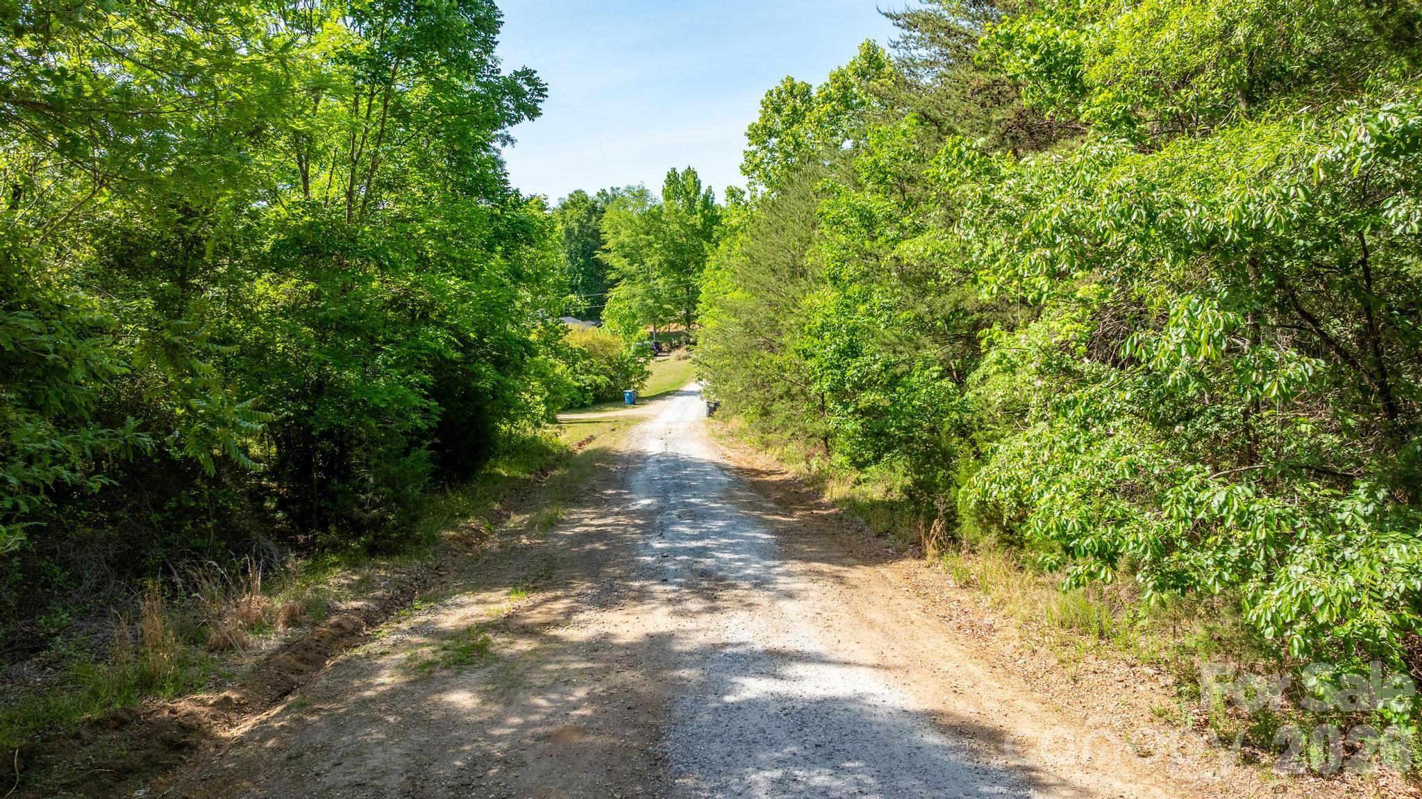 Located on Mountain Hall Rd in Cleveland, NC, this property sits in a quiet rural area with nearby homes, giving you both privacy and a sense of community. The land is gently wooded and usable, with electricity likely nearby due to surrounding homes, while water and septic would need to be installed (likely well and septic, based on the area). The property was inherited, is free and clear, has no HOA, and is believed to have no known restrictions or easements, offering flexibility for your future plans. reality. Seller financing is available!