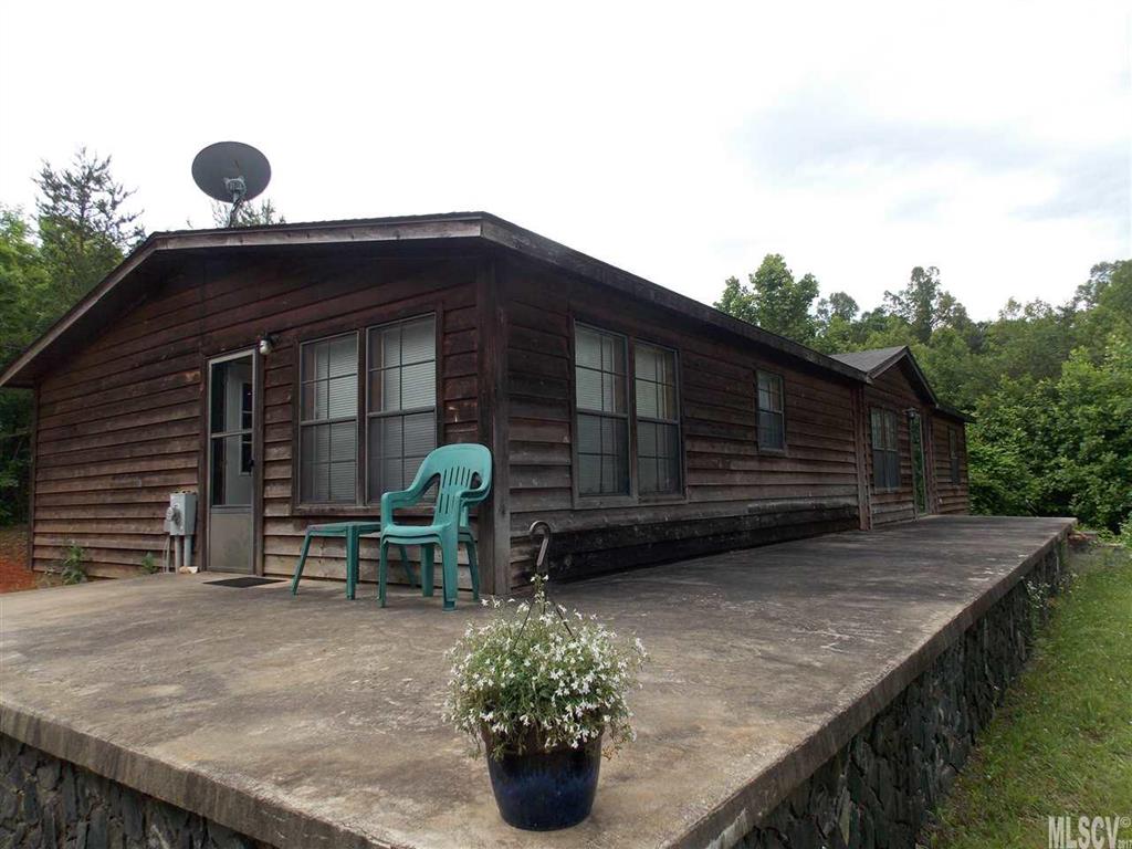 MOTIVATED SELLER!  Lots of room and ready to move in home with 2 acres,  3 bedrooms 2 bath, fireplace, huge kitchen with island, large master suite with large bath, several walk in closets, huge wrap around porch, outbuilding for storage, outdoor firepit, no city taxes, if you love the country you will love this home, country setting yet close to schools, I-40 and shopping