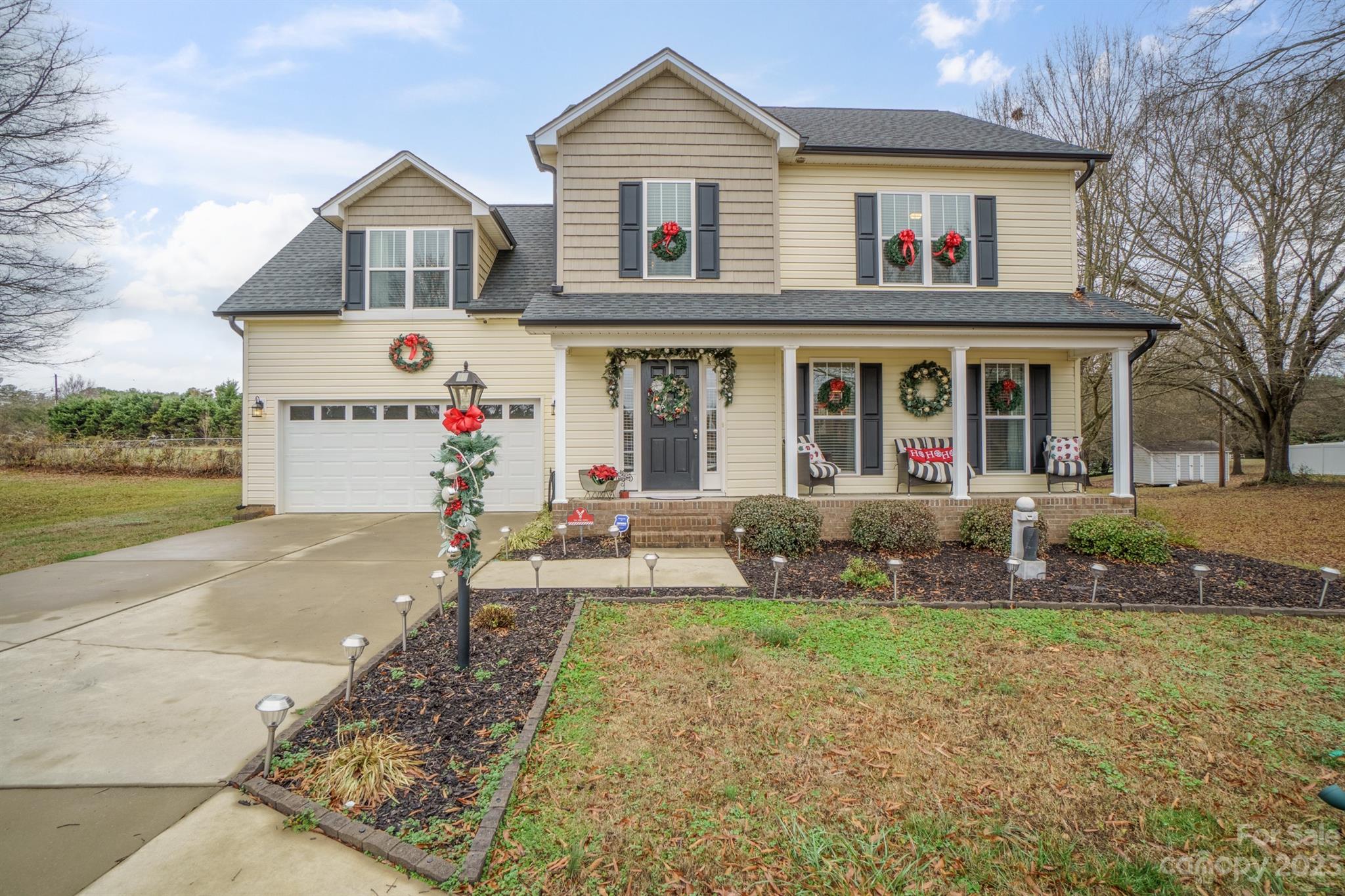 Step into the charm of the yellow house, now available for sale! Impeccably maintained, this two-story gem, built in 2017, promises a delightful living experience with a host of enticing features. Experience the benefit of a newly upgraded half bath downstairs. The kitchen is boasting stainless steel appliances, granite countertops, custom-made hardwood cabinets, & a backsplash. Walk-in pantry & a kitchen nook, complemented by a separate dining room.Cozy den with the fireplace. Upstairs, the primary bedroom welcomes you with double tray ceilings & newly replaced hardwood floors. For added convenience, find the washer and dryer upstairs. Large room upstairs, perfect for an office, playroom, or extra bedroom. Two-car attached garage with remote control clickers. What sets this property apart is the rarity of no HOA fees. Its strategic location, just 17 miles from Charlotte Airport & 21 miles from downtown Charlotte.