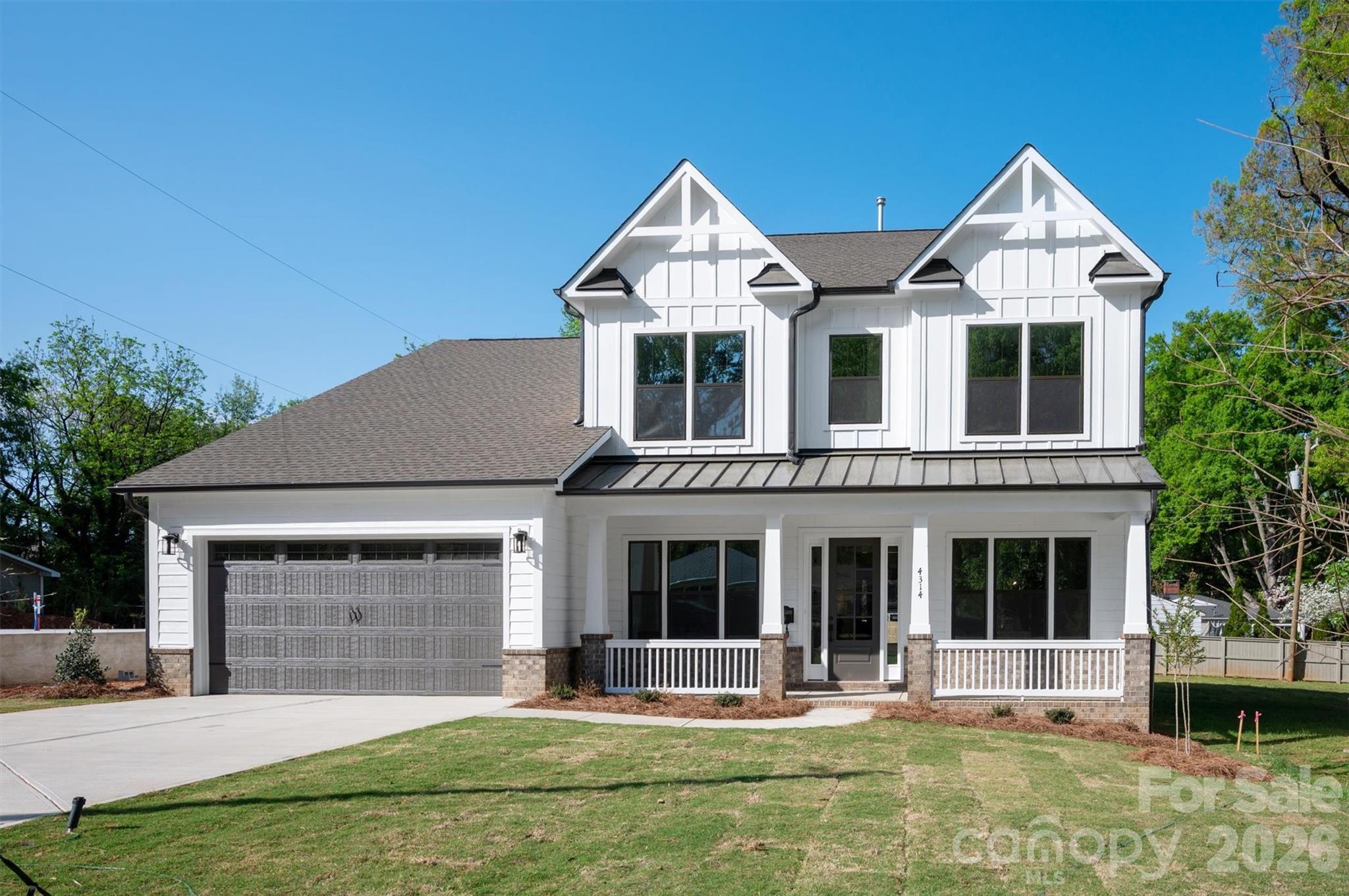 For buyers who appreciate exceptional design and craftsmanship but aren't interested in paying a premium for the same established neighborhoods everyone else is chasing, this home offers a compelling alternative. Located in the rapidly evolving Oakhurst community, this is the kind of neighborhood sophisticated buyers seek before it reaches its full potential. Positioned just minutes from Uptown, Plaza Midwood, and Cotswold, Oakhurst combines urban accessibility with the opportunity to build equity in an area experiencing significant investment and transformation. Walk to local restaurants, coffee shops, and a community garden while enjoying the convenience of being close to everything Charlotte has to offer. Inside, 4,147 square feet of thoughtfully designed living space includes 5 bedrooms, 4.5 baths, a gourmet kitchen with oversized island, walk-in pantry, custom cabinetry, and seamless flow into the main living and dining areas. The luxurious, main level primary suite features a spa-inspired bath with a freestanding tub and glass-enclosed shower. Dual laundry rooms, private office, guest spaces, and a large bonus loft provide versatility for modern living. Wide-plank flooring, designer lighting, abundant natural light, and covered front and rear porches showcase the home's attention to detail. This is luxury with perspective—a chance to own a high-quality new construction home in a neighborhood with momentum, character, and upside, rather than simply paying a premium for a ZIP code.