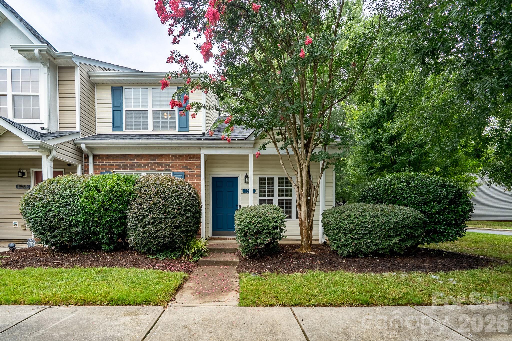 Spacious end-unit townhome featuring a desirable primary suite on the main level! The inviting living room showcases vaulted ceilings, beautiful bamboo flooring, and a cozy gas log fireplace. The bright kitchen offers stainless steel appliances, a breakfast bar, and a dining area overlooking the private rear yard. Fresh interior paint and a newer HVAC (2023) provide added value and peace of mind. Upstairs features a generously sized bedroom, full bath with vanity space, and an open loft with a walk-in closet and door that could easily be converted into a 3rd bedroom, home office, or flex space. Enjoy the privacy of an end unit along with access to the community pool, and a dog park, playground and recreation area nearby. Smart Ring doorbell conveys, adding convenience and peace of mind. Located just minutes from I-485 and Brookshire Boulevard, this home offers quick access to Uptown Charlotte, the Charlotte airport, the U.S. National Whitewater Center, and a variety of shopping and dining options in the nearby Northlake and Riverbend areas. This well-maintained home offers a functional floor plan, flexible living spaces, and low maintenance living in a desirable community.