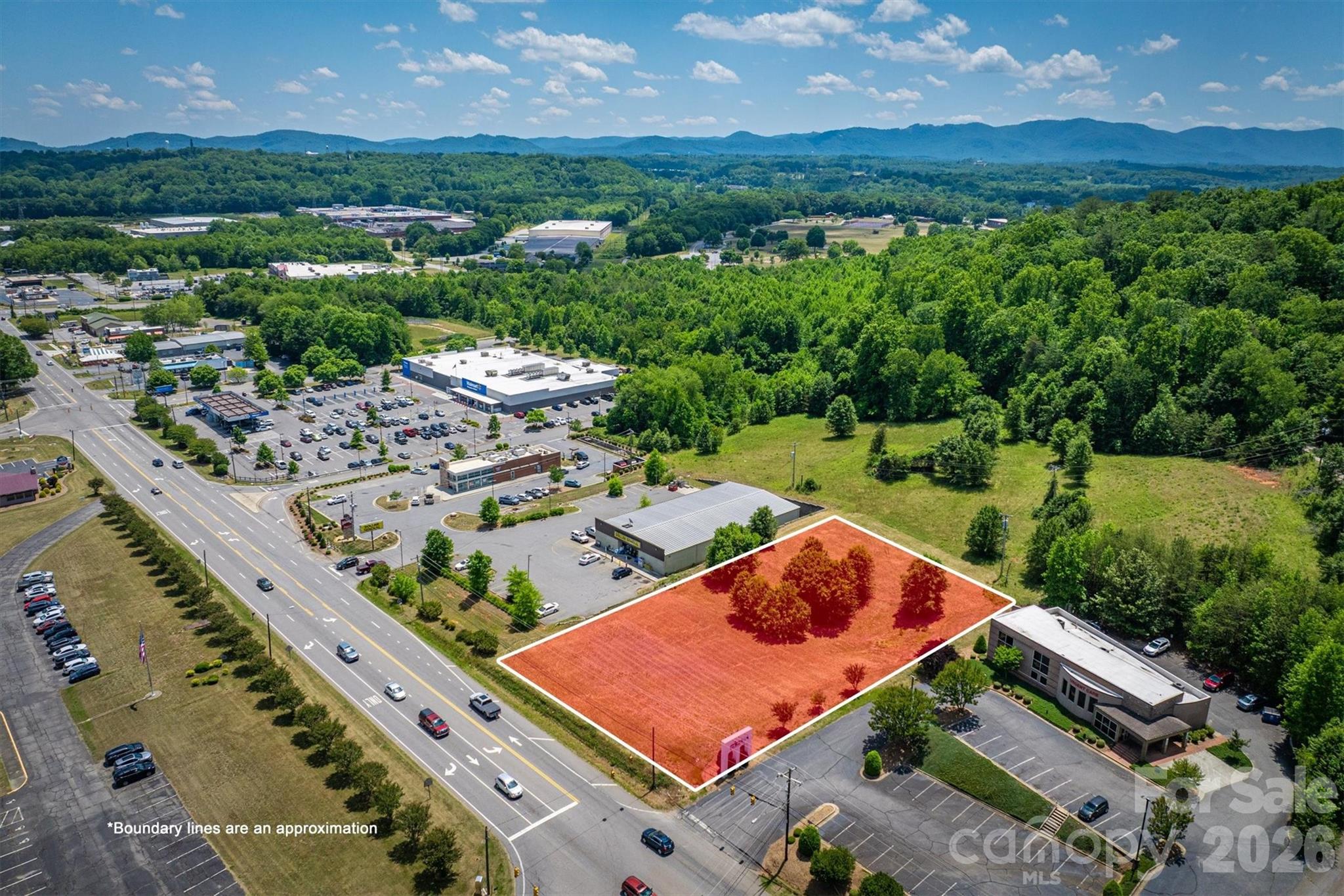 This cleared commercial lot along one of Morganton's busiest roads is ready and waiting for your next venture. Zoned for high-intensity development, the property occupies a prime position between established businesses including Dollar General and an urgent care facility, with Walmart Neighborhood Market just down the road. High traffic counts and excellent visibility make this an ideal location for your next business venture. The lot is already cleared and ready, so you can hit the ground running. Don't let this opportunity slip away-  reach out to schedule a showing today.