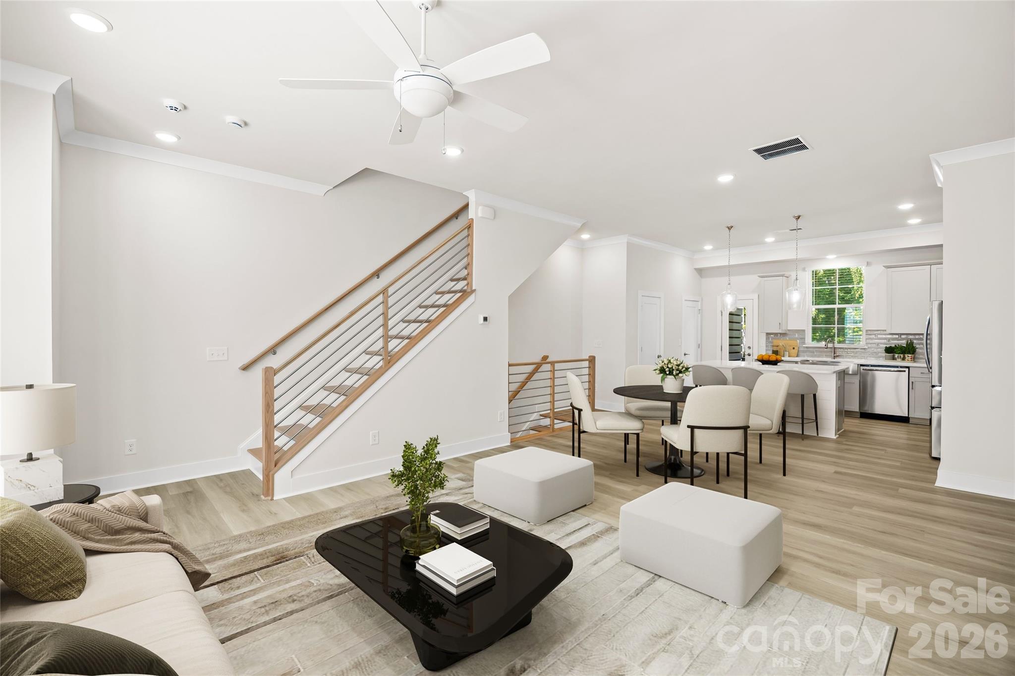 Move-in ready and built in 2024 by David Weekley Homes, this beautifully designed townhome offers the perfect blend of modern style, thoughtful functionality, and low-maintenance living. With a peaceful wooded backdrop, the home provides a rare sense of privacy while still being close to everything you need.

Inside, you'll find soaring ceilings, abundant natural light, and an open-concept floor plan that feels both spacious and inviting. The living, dining, and kitchen areas are designed for effortless everyday living and entertaining alike.

With three generously sized bedrooms, each featuring its own private en-suite bathroom, everyone can enjoy comfort and privacy. The primary suite is a true retreat, complete with a custom-designed walk-in closet that offers exceptional organization and storage.

The lower level features a versatile flex space, making it ideal as a private guest suite, home office, fitness room, or media space. Whether you're working from home, hosting visitors, or creating your own personal retreat, this flexible area adapts to your lifestyle.

Outside, enjoy a fenced front yard and the peaceful wooded views from the rear of the home. An attached two-car garage adds everyday convenience and additional storage.

Ideally located near some of Charlotte's most popular destinations, you'll enjoy easy access to the dining, shopping, entertainment, and neighborhood charm of NoDa, Plaza Midwood, Cotswold, and Uptown.

Thoughtfully designed, impeccably maintained, and truly move-in ready, this exceptional townhome offers the ideal combination of comfort, privacy, and contemporary living.