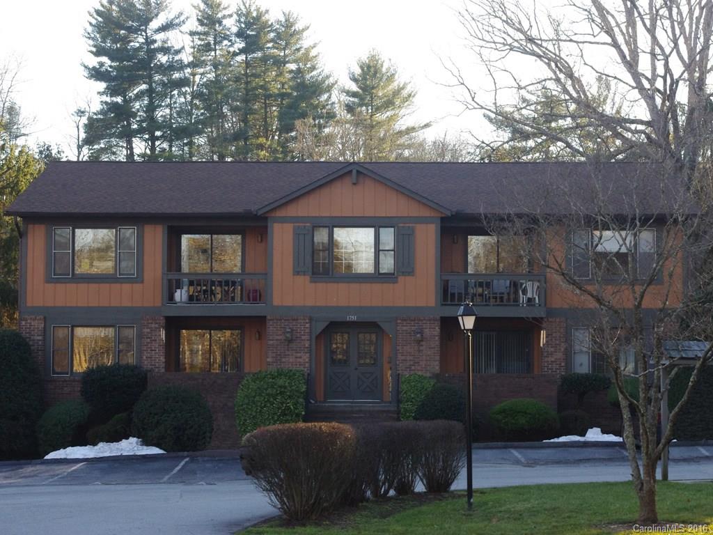 MODERNLY UPDATED and centrally located first floor condo with single car detached garage space. Dark color laminate floors in main living areas, custom crown moldings and wainscoting, stainless steel appliances, new carpet in bedrooms, two master bedrooms each with en-suite bath and walk-in closet. Tiled front patio and private south facing rear screened porch offer plentiful outdoor living space. Storage galore. Maintenance free living within walking distance to downtown Hendersonville.