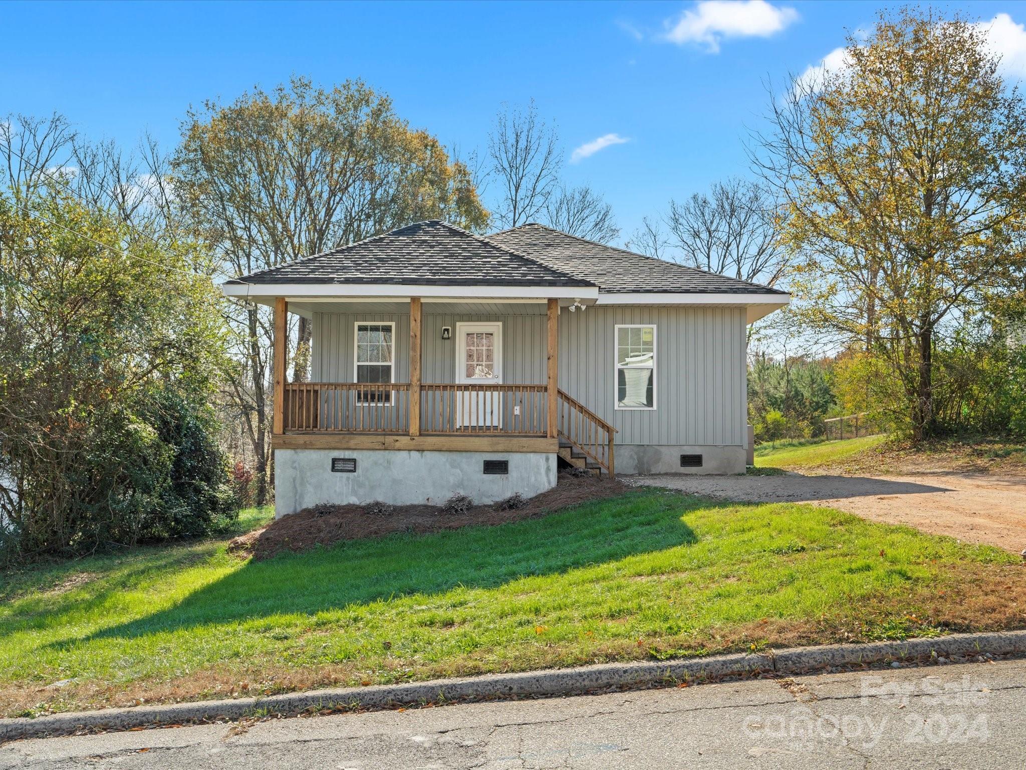 Welcome to Clover! Tastefully renovated, vinyl-sided, ranch style, home with 3 Bedrooms, 2.5 Bathrooms and has approximately 1203 Heated Square Feet.  This home has open great room, kitchen and dining area. Nice Kitchen that features granite countertops, LVP flooring, stainless steel appliances, and breakfast bar. This is a wonderful split bedroom plan with the front 2 bedrooms being connected  by a bathroom.  Covered front porch and large rear deck. Gas Pack and and Architectural Roof was recently installed. Double Pane windows. This home is located just minutes from eating establishments, convenience stores and grocery stores. Make your appointment to view this home today!