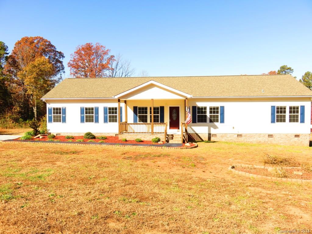 Beautifully updated home on one acre of land priced below assessed value and located five minutes from Denver, NC. Comes with a 1 year warrany!  Brand new floors and paint with wood burning fireplace.  Kitchen is modern with island, backsplash, stainless steel appliances, recessed lighting, expensive cabinets.  master bathroom has dual sinks with a ceramic surround shower and ceramic tile floor.  Master bedroom also has a separate sitting room and very large closet. Motivated to sell!