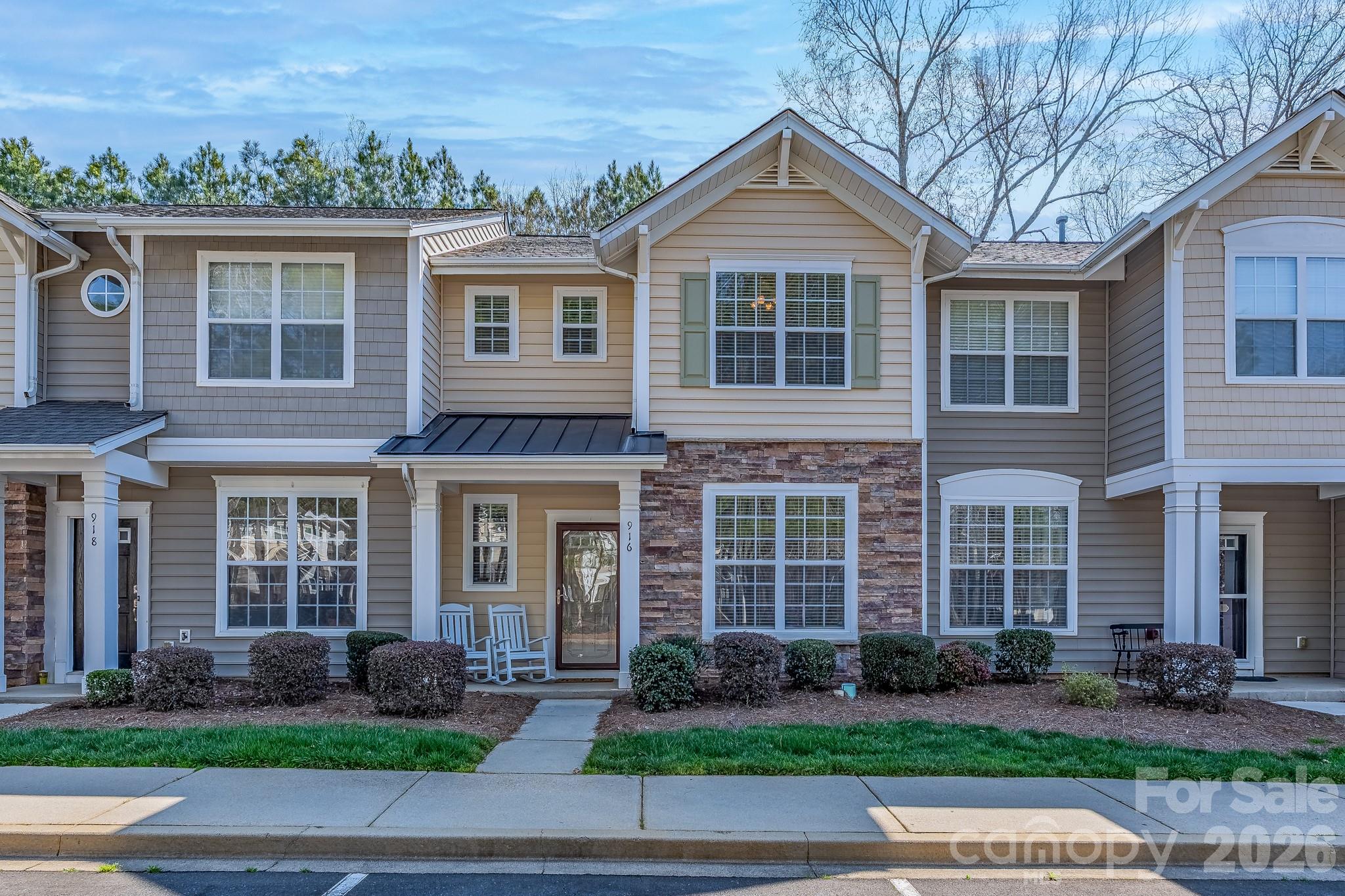 This townhome is ready to welcome you! The main level features hardwood floors and is home to a family room with fireplace, kitchen with granite countertops, dining/breakfast area, powder room, and a flex room that can be used as a dining room or home office. The primary bedroom, two other bedrooms, two bathrooms, and the laundry area are located on the upper level. A new chair lift was installed in 2025 making the upstairs available to access without steps. The home was painted and new carpet as well as HVAC were installed in 2022. Enjoy the privacy of a fenced-in patio in the back and explore the walking trails in this great neighborhood. As a part of the Ridge Pointe community, you have access to the neighborhood pool and playground. Come see all this one offers you!