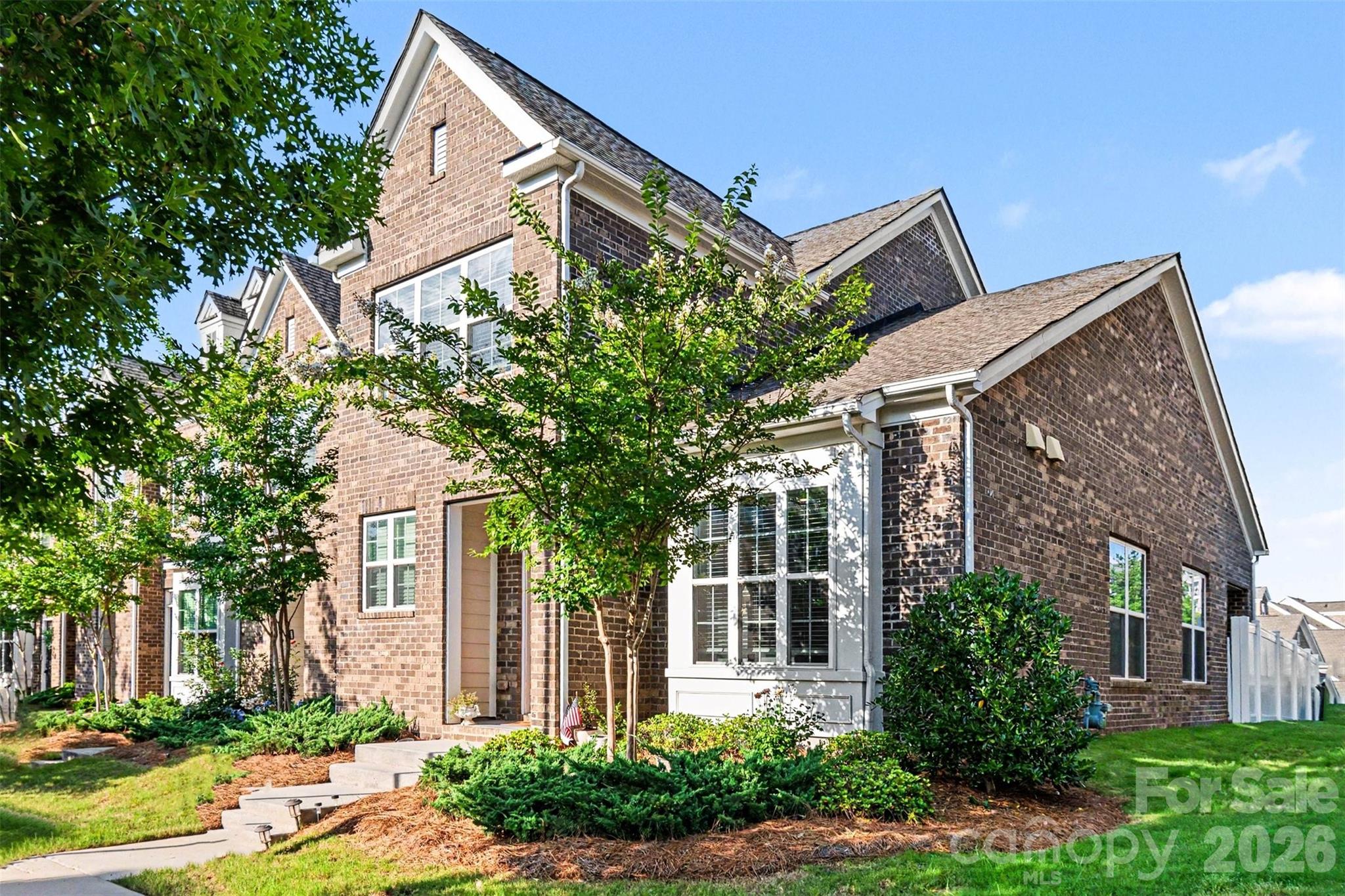 Rarely available in sought-after Rea Farms, this move-in-ready end unit townhome offers a spacious primary suite and dedicated home office on the main level, delivering the ease and flexibility today's buyers are searching for. Offering the perfect blend of luxury, convenience, and low-maintenance living. Thoughtfully designed with modern finishes, an open-concept layout and a fully fenced yard. This home is just steps away from premier shopping, dining, fitness, and entertainment. Combining convenience, comfort, and one of South Charlotte's most desirable addresses, this exceptional home is a rare opportunity not to be missed. Tesla charger in garage to convey with acceptable offer.