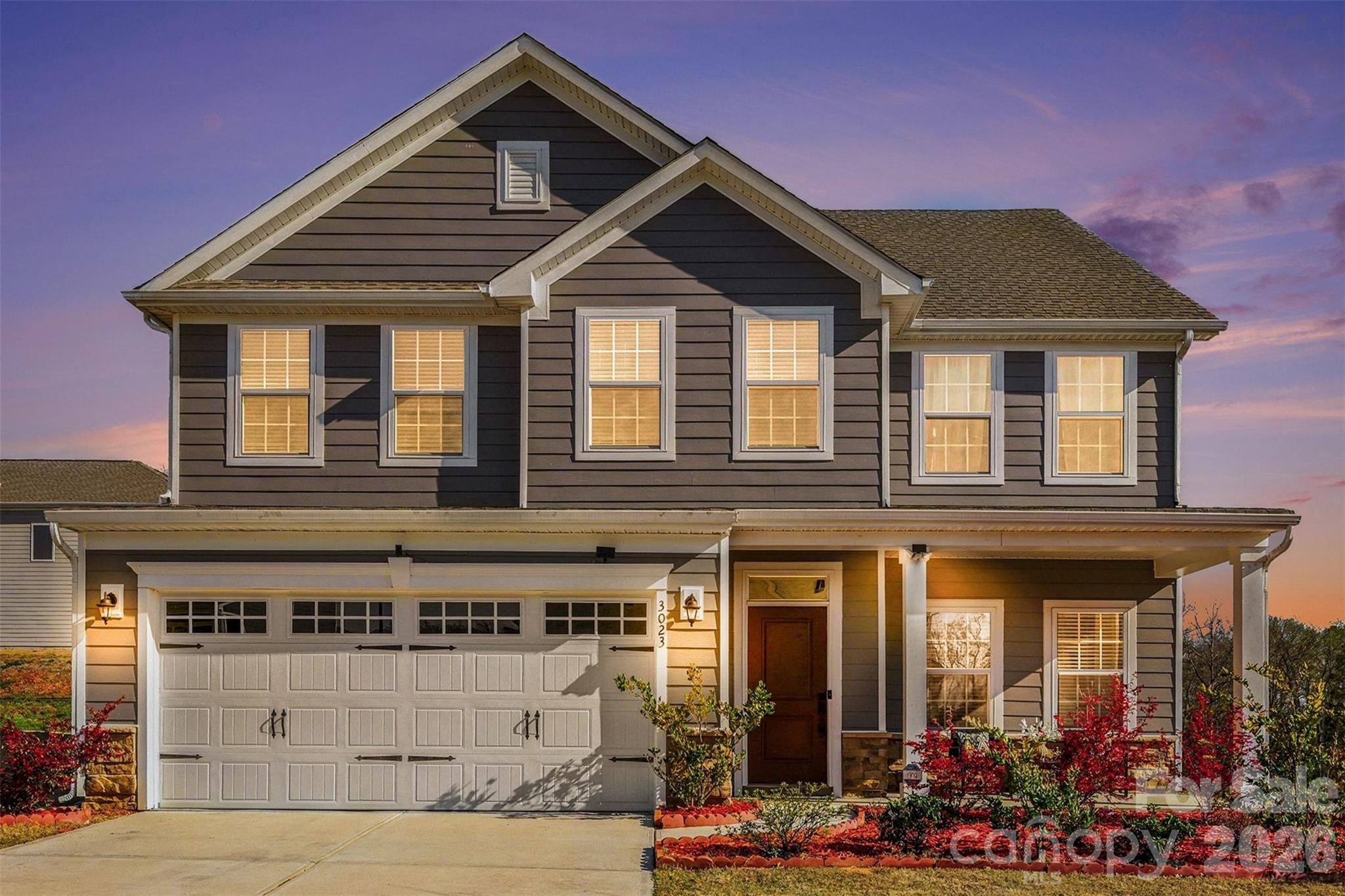 An Ansley Park dream—far from builder grade. Backing to peaceful tree-lined views with BRAND NEW PRIVACY FENCE installed in the backyard, this upgraded Hudson model offers the perfect blend of space, flexibility, and thoughtful design throughout. The inviting front porch, enhanced by an upgraded elevation for added size and presence, sets the tone as you step inside to a bright, open layout ideal for both everyday living and entertaining.

The main level features brand new LVP flooring,  a private bedroom suite with a full bath, perfect for guests or multi-generational living. At the heart of the home, the kitchen shines with a large island, gas range, tile backsplash, and abundant cabinetry, seamlessly flowing into the main living areas. Just beyond, the expanded patio creates an ideal outdoor retreat to relax and unwind while enjoying the serene wooded backdrop. Warm wood accents along the staircase add character and charm.

Upstairs, the builder loft has been thoughtfully converted into a true fifth bedroom, offering even more flexibility for living, working, or hosting. The spacious primary suite features dual walk-in closets and an upgraded bath complete with a tiled shower and soaking tub.

Located in a community with resort-style amenities including a pool, playground, and walking trails, this home also offers unbeatable convenience—just minutes from Costco, Target, Lowe’s Foods, and the Indian Land YMCA.