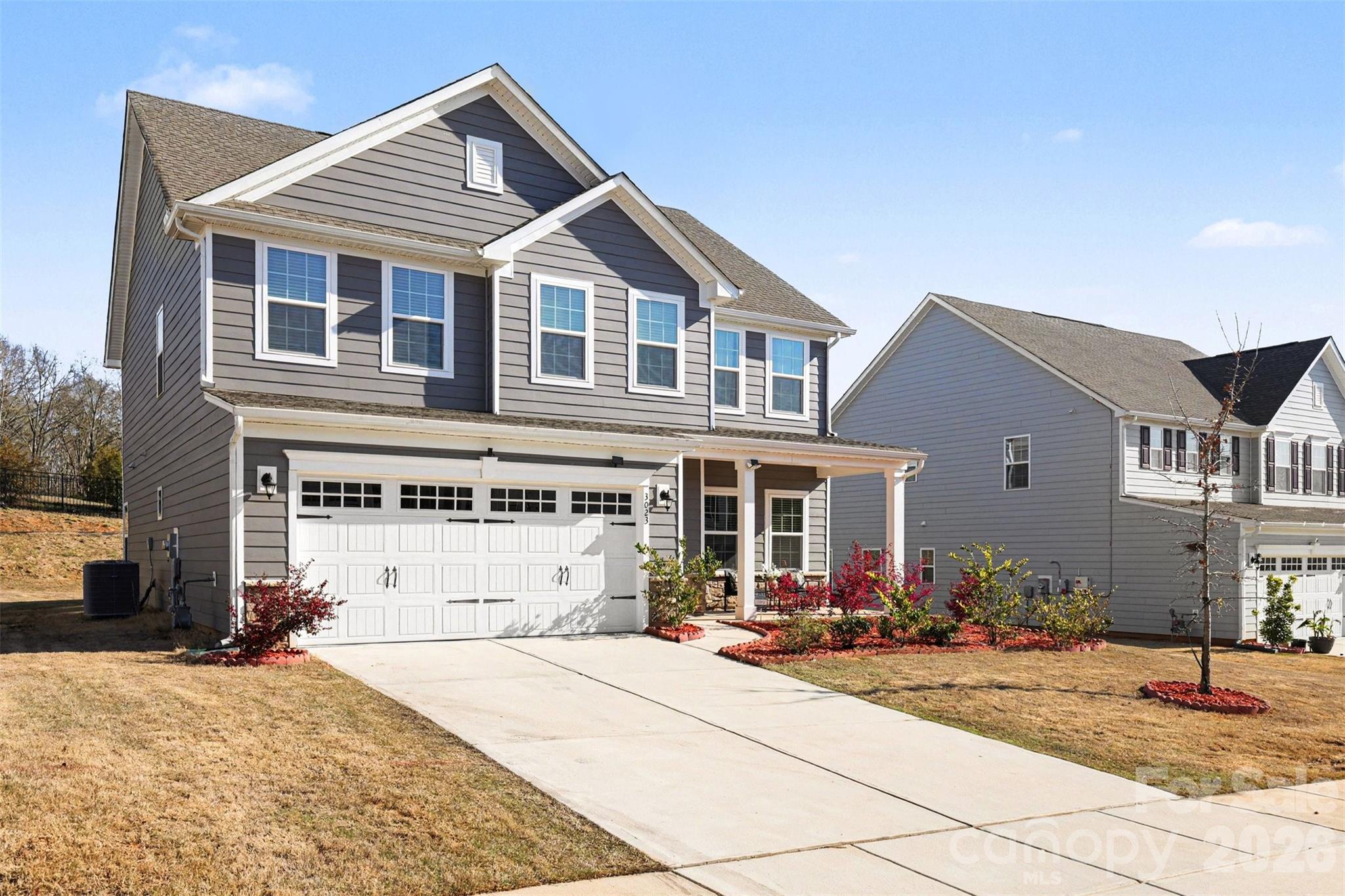An Ansley Park dream—far from builder grade. Backing to peaceful tree-lined views with BRAND NEW PRIVACY FENCE installed in the backyard, this upgraded Hudson model offers the perfect blend of space, flexibility, and thoughtful design throughout. The inviting front porch, enhanced by an upgraded elevation for added size and presence, sets the tone as you step inside to a bright, open layout ideal for both everyday living and entertaining.

The main level features brand new LVP flooring,  a private bedroom suite with a full bath, perfect for guests or multi-generational living. At the heart of the home, the kitchen shines with a large island, gas range, tile backsplash, and abundant cabinetry, seamlessly flowing into the main living areas. Just beyond, the expanded patio creates an ideal outdoor retreat to relax and unwind while enjoying the serene wooded backdrop. Warm wood accents along the staircase add character and charm.

Upstairs, the builder loft has been thoughtfully converted into a true fifth bedroom, offering even more flexibility for living, working, or hosting. The spacious primary suite features dual walk-in closets and an upgraded bath complete with a tiled shower and soaking tub.

Located in a community with resort-style amenities including a pool, playground, and walking trails, this home also offers unbeatable convenience—just minutes from Costco, Target, Lowe’s Foods, and the Indian Land YMCA.