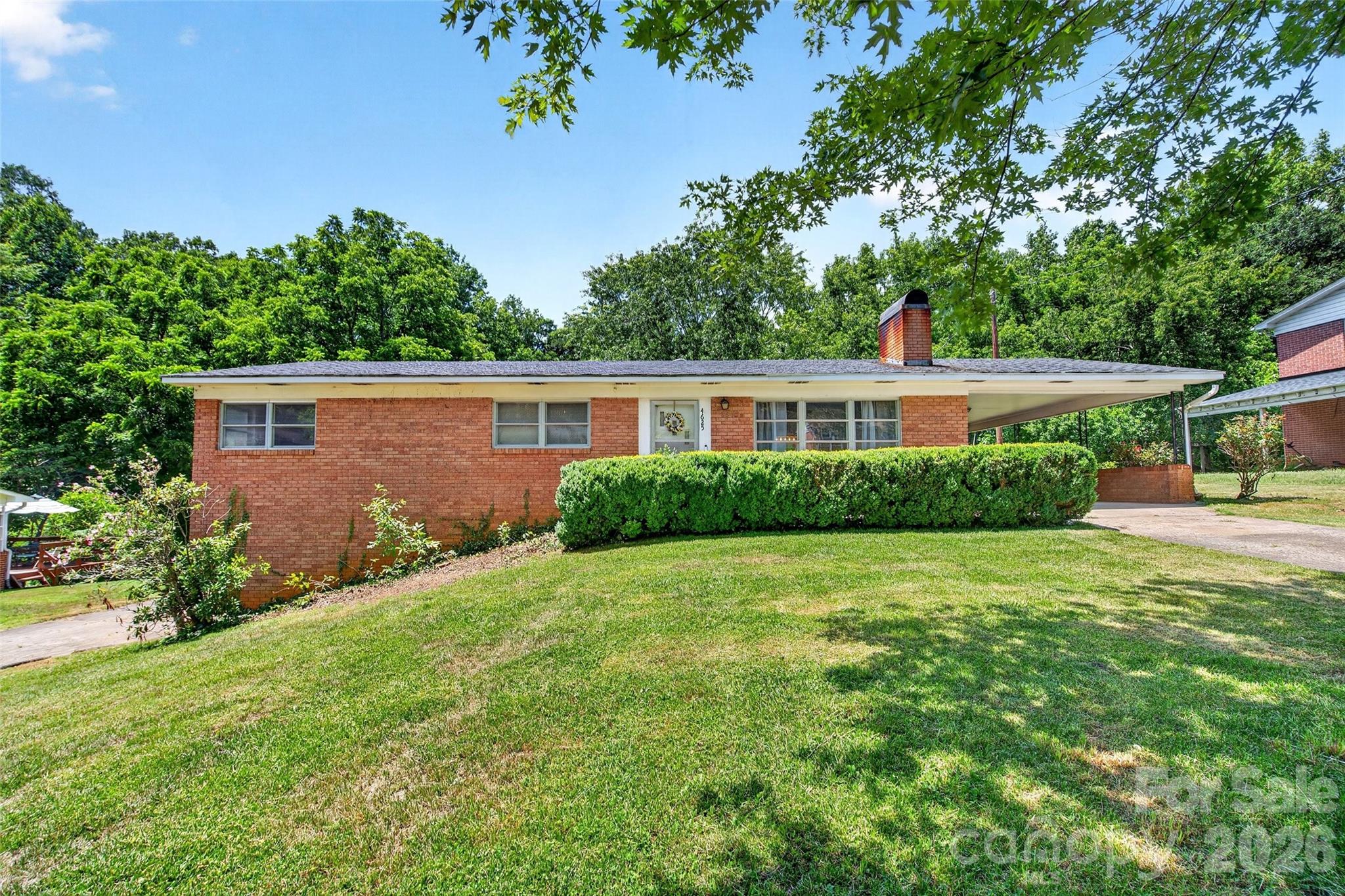 **Home Sweet Home: Charming Brick Ranch with Endless Possibilities!** 1-yr Home Warranty Included! 
Step into this inviting 3-bedroom, 1-bath brick ranch, complete with a full-size unfinished basement and an additional outbuilding featuring its own basement—perfect for an office, workshop, or whatever suits your needs! With a little creativity, this space can easily transform into an additional living area.
Nestled in a friendly, low-traffic neighborhood, this home boasts an open layout that seamlessly connects the kitchen, dining area, and spacious living room, creating the ideal atmosphere for gatherings. The living room is a highlight, featuring a lovely fireplace with a woodstove insert and beautiful built-ins that add a touch of charm.
All three bedrooms offer generous space, complemented by a full bathroom conveniently located in the hallway. The basement provides easy access through a garage door, an indoor entry, and laundry facilities (previously used in one of the upstairs bedrooms).
Convenience continues outside with a concrete drive leading to an attached carport, making access to the kitchen and dining room a breeze. The lower drive is asphalt, with ample parking for multiple vehicles, RVs, ATVs, or boats.
Enjoy a nicely sized front and back yard, featuring a level area perfect for entertaining family and friends. Conveniently located less than a mile from the stunning McGalliard Falls Park and just 5 miles from Castle Bridge Marina on Lake Rhodiss, this property provides easy access to some of Western NC's most beautiful natural attractions, including waterfalls, lakes, rivers, and hiking trails.
Embrace the picturesque lifestyle that awaits you in this charming home! Agent related to the owner