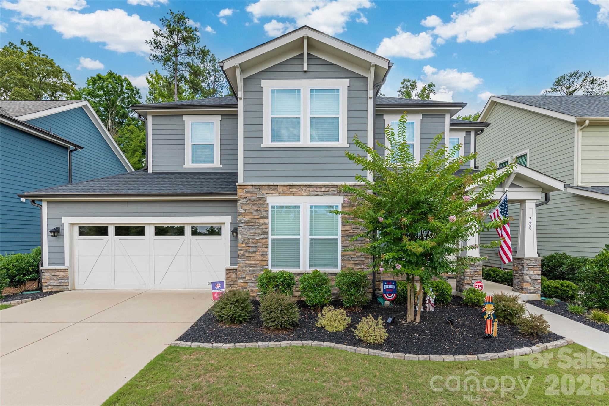 Welcome to this immaculately maintained one-owner home in the highly desirable Paddlers Cove community, where convenience, comfort, and exceptional amenities come together. This contemporary home is thoughtfully upgraded throughout and offers the perfect blend of modern design and everyday functionality. The gourmet kitchen is designed to impress, featuring stainless steel appliances, soft-close cabinetry with under-cabinet lighting, a five-burner gas cooktop with pot filler, abundant workspace, and an open layout ideal for gathering with family and friends. The home's entertainment package includes a 5.1 surround sound digital audio/Bluetooth system expanding into the living room, backyard screened-in patio & primary bedroom, creating an immersive experience whether you're hosting guests or enjoying a quiet evening at home. Relax with peace of mind thanks to a security system, keyless front door entry, 2025 water heater and low-maintenance living. The spacious enclosed screened patio with tile flooring and a gas fireplace extends your living space outdoors, while the fenced backyard that backs up to mature abundant trees provides privacy and room to unwind. Located just minutes from shopping, dining, and everyday conveniences, Paddlers Cove offers an unmatched lifestyle with resort-style amenities including two community pools, a clubhouse, and direct access to nearby Field Day Park with pickleball courts, athletic fields, playgrounds, scenic walking trails, lake access with a paddle launch, all just minutes the waterfront lifestyle of Lake Wylie and Charlotte. Top rated Clover schools including the new Lake Wylie High School are a big plus! This just may be the one you've been looking for.