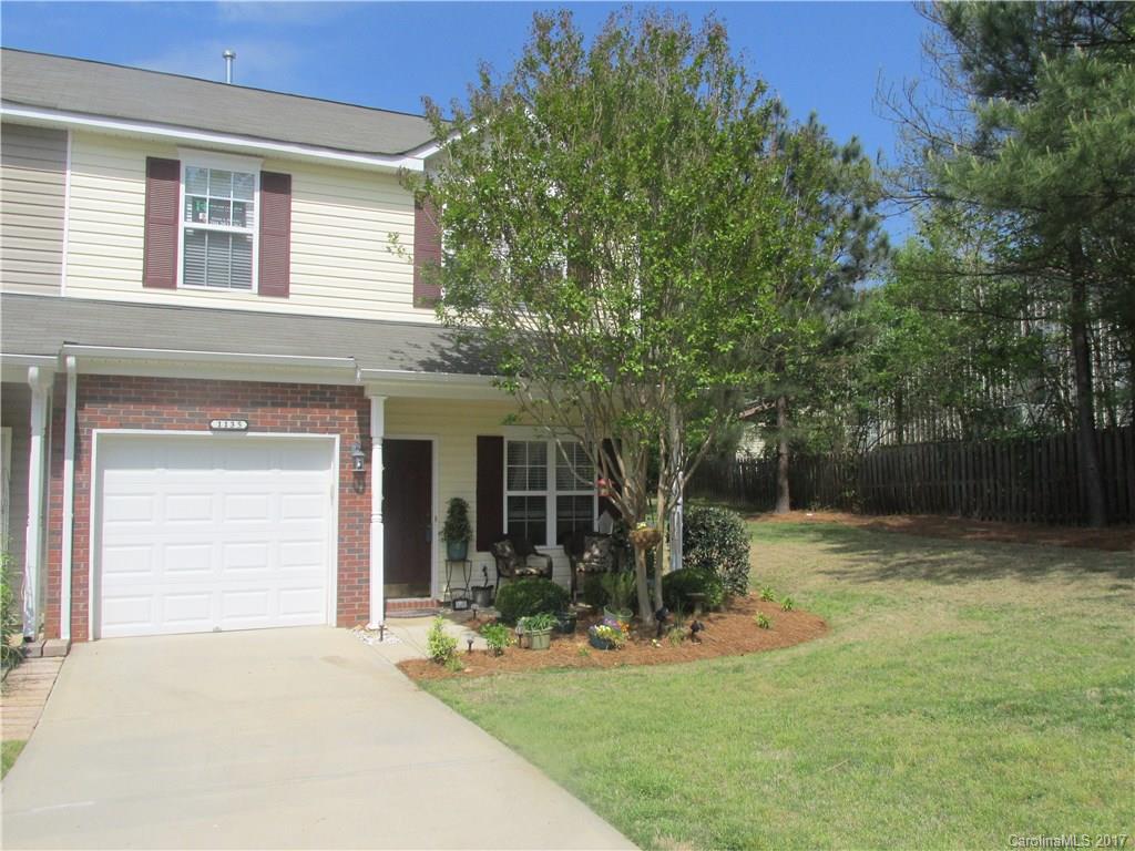 Nicest lot in the community! 3 Bedroom, end unit with garage that backs up to woods. Located in desirable Fort Mill.  One of the fewer homes in this community with enough room in the driveway to park two cars!   Kitchen has 42" cabinets and upgraded appliances.  New Microwave on order and will be installed prior to closing. Fireplace in family room on the main level.  In addition to the three bedrooms, there is an extra room in the front of the house that can be used an office.