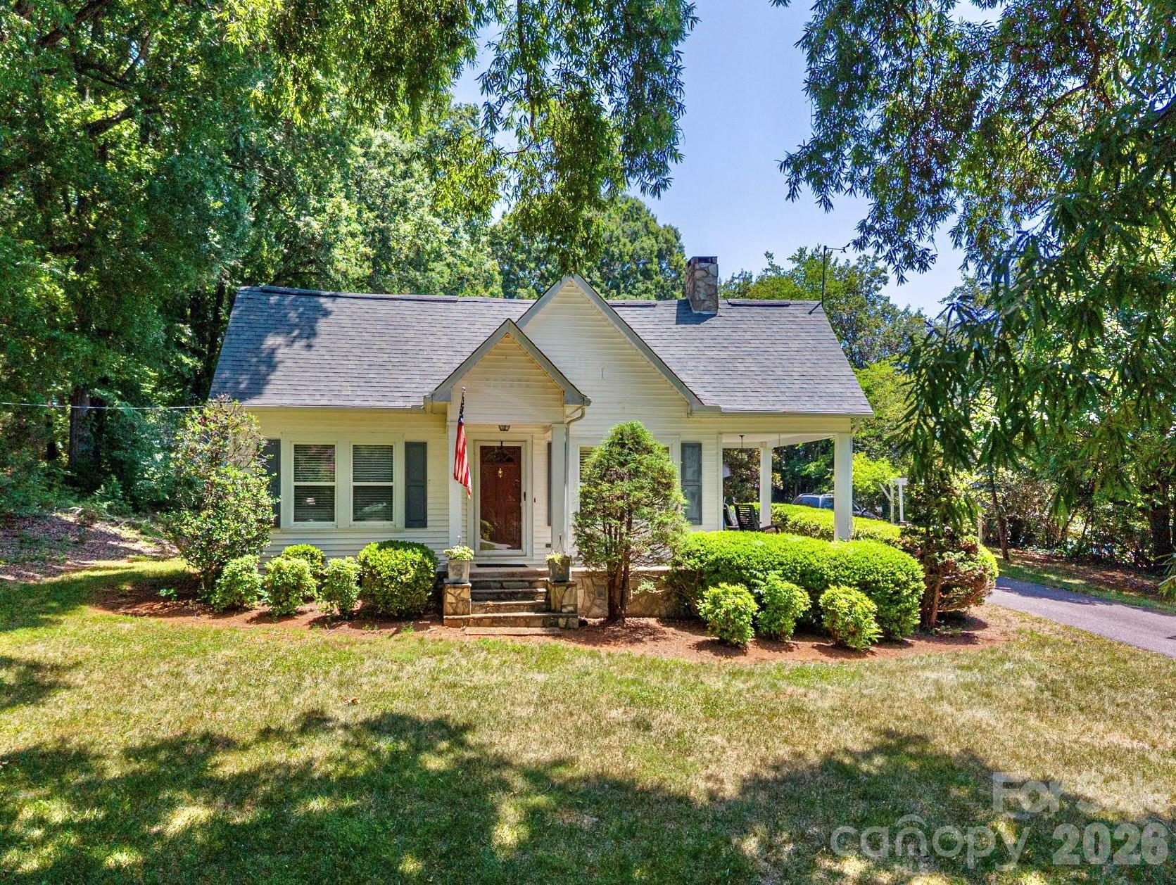 This beautiful 3 bedroom, 2 bath home combines timeless character with modern updates, all nestled on just over 1 acre of private, peaceful surroundings. From the moment you step inside, you'll appreciate the home's unique charm featuring elegant arched doorways, crown molding, and solid wood bedroom doors, including a stunning exotic mahogany door leading to the primary bedroom.  The updated kitchen offers gorgeous quartz countertops, stainless steel appliances, and opens to living spaces with new flooring installed in the living room and kitchen in 2026. Additional updates include an HVAC system approximately 1 year old and a roof replaced approximately 6–8 years ago, providing added peace of mind.  Plantation shutters add warmth and style to the living room and middle bedroom, while the show stopping sunroom is perfect for outdoor enthusiasts. With approximately 460 square feet of additional living space and custom blinds, it's an ideal spot to enjoy nature year round, entertain guests, or simply relax with your morning coffee.  Outside, you'll find two wired outbuildings, including one currently set up as a wood workshop, offering endless possibilities for hobbies, storage, or workspace. Surrounded by mature trees and plenty of privacy, this property provides the perfect blend of comfort, functionality, and country living.  Don't miss the opportunity to own this one of a kind property that offers character, quality updates, and space to enjoy both inside and out!