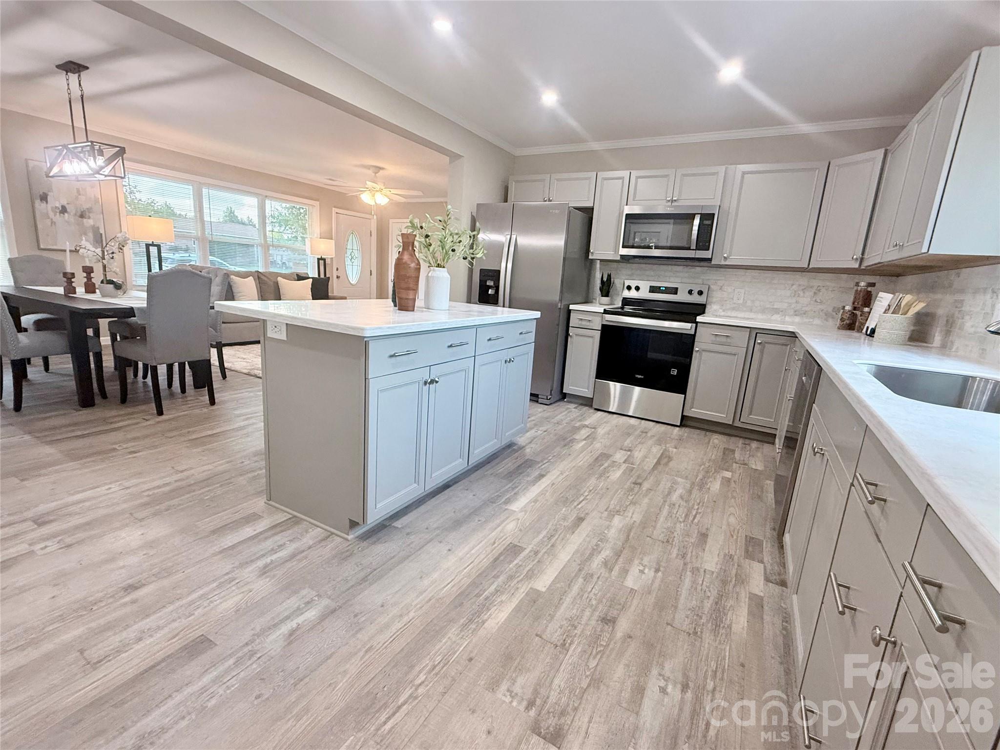 Welcome to 3388 Rhyne Forest Road — a beautifully transformed home where modern updates, quality craftsmanship, and peace of mind come together! This 3 bedroom, 2 bathroom home has been extensively renovated inside and out with thoughtful improvements, stylish finishes, and major upgrades throughout.

Step inside to a bright, inviting interior featuring new windows, new LVP flooring, fresh drywall and paint, updated fixtures, and a functional layout designed for today’s lifestyle. The completely renovated kitchen is the heart of the home, showcasing brand new cabinetry, beautiful countertops, stainless steel appliances, and modern finishes — perfect for cooking, entertaining, and everyday living.

The private primary suite offers a beautifully updated ensuite bathroom, while two additional bedrooms and a second fully renovated bathroom provide comfortable space for family, guests, or a home office.

The updates continue well beyond what you see — with improvements designed for comfort, efficiency, and long-term peace of mind, including new insulation, windows, updated electrical, new plumbing, new HVAC, new septic system, new well pump and pressure tank, new vinyl siding, and more. Renovations were completed with proper permits, county inspections, and approvals, providing added confidence in the quality of the work.

Outside, enjoy even more space to relax and entertain with a charming new front porch, spacious new back deck, fenced backyard, and a nearly half-acre lot. The attached carport adds everyday convenience, while the outbuilding complete with electricity and AC offers incredible flexibility — perfect for a workshop, hobby area, home office, gym, or additional storage.

Located in a quiet, peaceful community within the desirable East Lincoln school district, this home offers a relaxing country feel while keeping you conveniently connected to Lincolnton, Hickory, Lake Norman, and Charlotte.

Beautifully updated, thoughtfully renovated, and move-in ready — this is the one you’ve been waiting for!