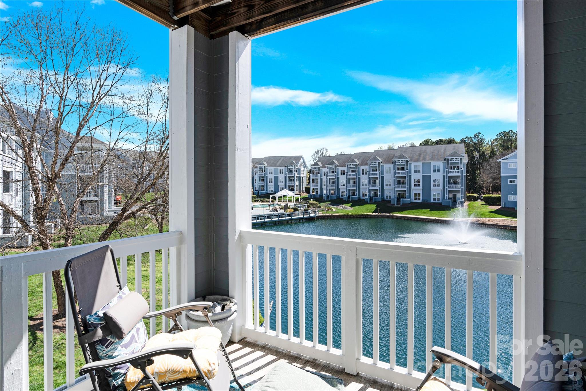 Wake up to beautiful water views in this inviting 2-bedroom, 2-bath condo designed for comfort and easy living.  Wonderful open floorplan with granite countertops in kitchen and tile backsplash.  Spend your mornings sipping coffee, gazing upon the picturesque view of the water on your covered patio.  The thoughtfully designed split-bedroom layout offers privacy, a spacious primary bathroom with oversized tile shower and double top vanity.  Community sits on the beautiful Lake Norman with its very own beach and offers all amenities including tennis, pool, fitness room, kayak and boat launch.