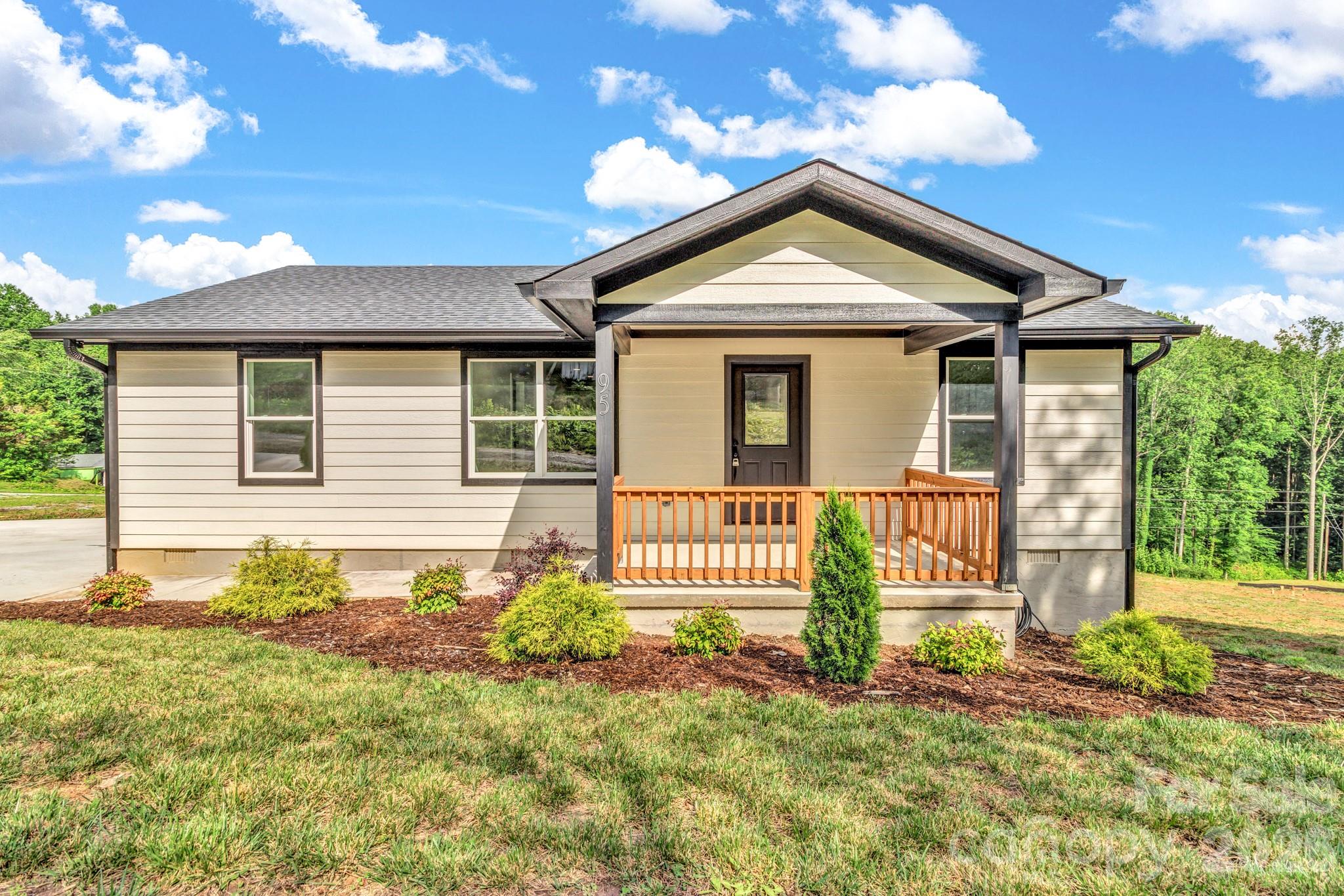 Experience the perfect combination of modern comfort and peaceful mountain living in this beautifully constructed 2-bedroom, 2-bath home. Designed with both style and functionality in mind, the bright, open-concept floor plan creates an inviting atmosphere ideal for everyday living and entertaining. The well-appointed kitchen serves as the heart of the home, featuring a large butcher block island, attractive finishes, and seamless flow into the main living areas. A desirable split-bedroom floor plan provides privacy and comfort, while the spacious family room offers ample space for gathering with family and friends. The professionally landscaped exterior reflects the care and attention given throughout the property. Situated on almost half an acre, this property offers a peaceful setting with beautiful mountain views and plenty of outdoor space for gardening, recreation, or simply enjoying the surrounding natural beauty. Relax on the inviting porches and take in the serene atmosphere that makes this home a true retreat. Additional features include a large walk-in crawlspace providing excellent storage and multiple parking areas for convenience. Ideally located just minutes from downtown Marion and with easy access to I-40, the property offers a convenient commute to Asheville while maintaining the tranquility of country living. This exceptional property presents a wonderful opportunity to enjoy comfortable living in a scenic and convenient location.