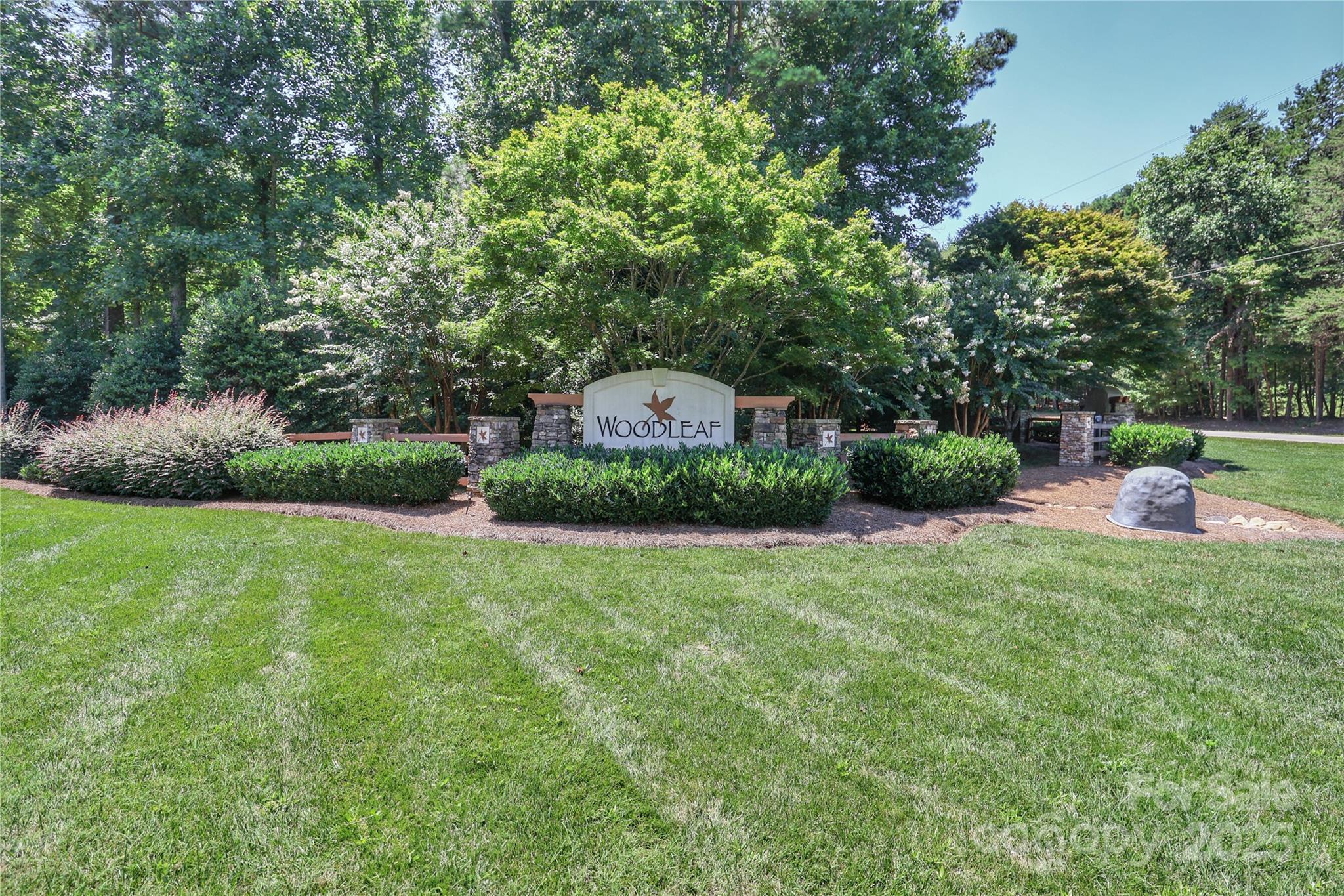 Lot #114 in the desirable Woodleaf neighborhood presents a great opportunity to build your dream home with well-established Princeton Homes. This nearly one-acre wooded lot offers privacy and is surrounded by beautifully maintained homes. Located in Mooresville, just minutes from LAKE NORMAN, LAKE NORMAN STATE PARK, MARINAS, BOAT LAUNCHES, PARKS, SCHOOLS, SHOPPING, MEDICAL FACILITIES, and VETERINARY SERVICES—this peaceful setting combines comfort and convenience. The purchase of this lot requires a build agreement with Princeton Homes, known for their modern designs and commitment to quality. Choose from existing floor plans or bring your own. Enjoy a seamless and personalized building experience in a well-kept community—a strong value in a highly sought-after location!