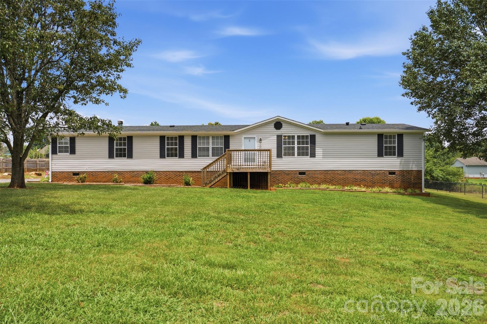 Beautifully renovated 4-bedroom, 2 bathroom offering over 2100 heated SQFT on a level lot. This spacious split bedroom floor plan includes a dedicated office/flex room, a large living area, dining space and a generously sized kitchen with pantry. Recent updates include a New HVAC(2024), New appliances(2024), updated lighting and ceiling fans, fresh paint and a remodelled fireplace. Luxury vinyl plank flooring throughout. The primary suite features a walk-in closet and a private bath. Enjoy outdoor living from the rear deck overlooking the yard that is privately fenced. The home is served by a private well and septic. NO HOA! Move-in ready and waiting for its new owners. All this on a little over a half acre.