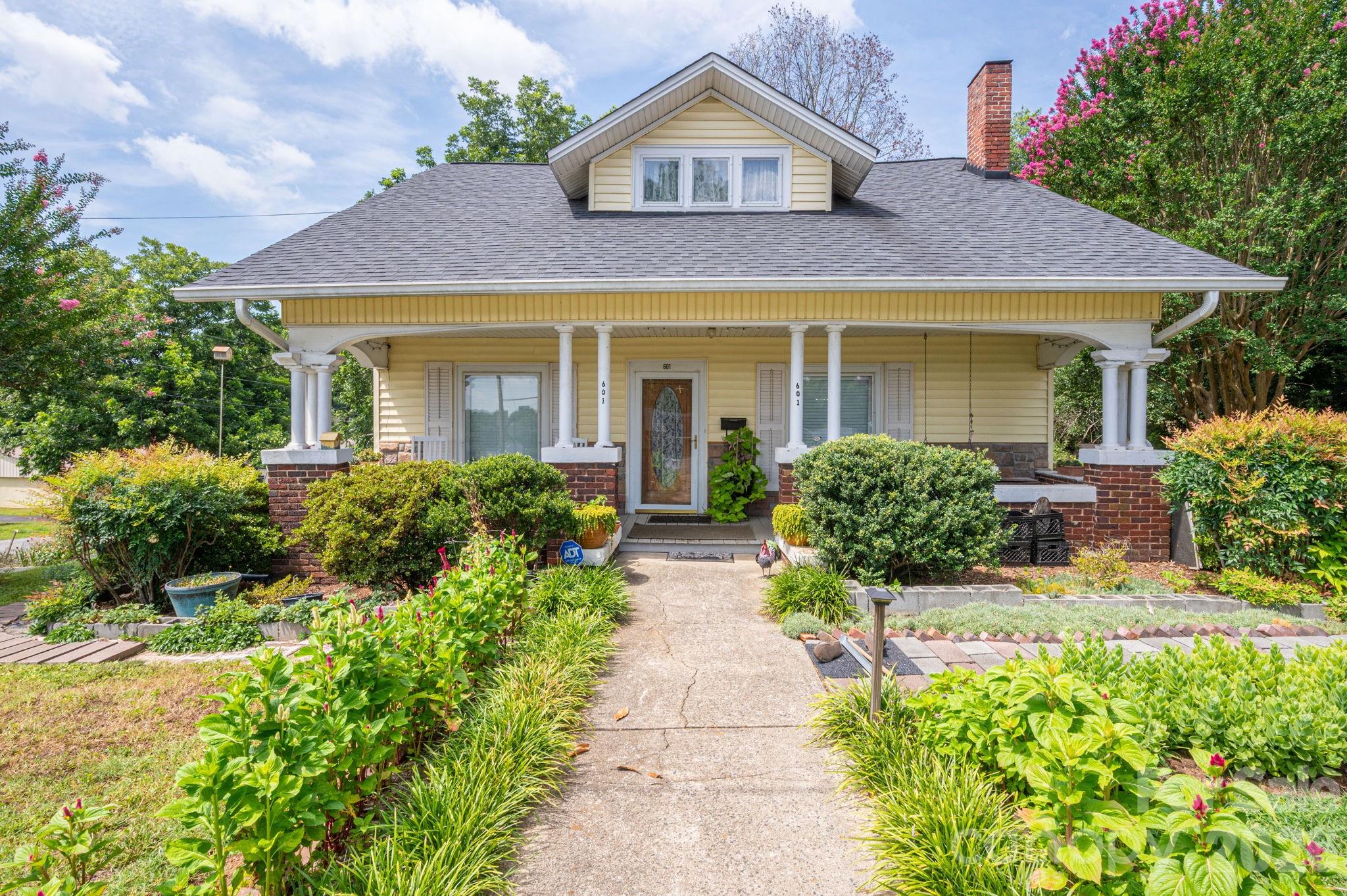 This charming home is filled with character and history. As you step onto the covered front porch, take a moment to relax on the porch swing and enjoy the peaceful setting. Inside, the first floor features a spacious living room, an office/den, and an additional room with a closet added, offering the convenience of a potential first-floor bedroom. Hardwood floors and beadboard ceilings add warmth and timeless charm throughout the main level.

Upstairs, you’ll find additional bedrooms and a full bath. A bright sunroom provides flexible space and could easily serve as a playroom, craft room, or extra bedroom. Outside, a detached building/shed with electricity offers excellent storage, workshop, or hobby space. Situated on a large corner lot just outside the downtown area, this property offers both charm and convenience.