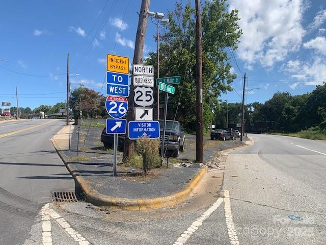 THIS MAY BE THE "LAST TIME" TO BUY AN OPEN CORNER ON US HWYS IN HISTORIC DOWNTOWN HENDERSONVILLE, NAMELY "MAIN STREET" AND "KING STREET" ... A HOMETOWN CARLOT FOR DECADES.
   YES, THIS WORLD IS CHANGING IN HENDERSONVILLE, 100-15O YEARS AGO WE WERE RIDING HORSES, WAGONS, ETC. THEN ON OUR MAIN STREET FORDS AND CHEVYS AND EVEN DUSENBURGS, AUBURNS, TODAY ANYTHING INCLUDING ROLLS ROYCE AND KIAS ... PRE-DOMINATE THING NOW HERE IS ""ROUND-ABOUTS" ... DRIVEBY AND NOTICE FROM THIS POINT/CORNER ... LOOK SOUTH ... MOST IS GONE, ... LOOK NORTHWARD AND SEE DOT PLANS/RUMORS, WHERE THE HVL "WELCOME TO" SIGN IS TO BE LEVELLED/GONE ...
   PLANS FOR SURE CAN BE CHANGED ... BUT KEEP IN MIND THIS PROPERTY FOR SALE DOES HAVE NEW RIGHT OF WAY POINTS, BUT IT WILL BE THERE ... AND VALUABLE- WHOMEVER'S IT IS THERE. COULD BE YOU.
   MOST ALL OF US LOVE THIS BEAUTIFUL LITTLE MOUNTAIN TOWN ... TAKE A TRIP TO CHARLOTTE, ATLANTA, EVEN ASHEVILLE ... NONE HAS THE SAME AS HISTORIC DOWNTOWN AS HENDERSONVILLE. MY FAMILY AND I EARLIER TODAY VISITED THE APPLE FESTIVAL, ATE THE BEST PIZZA AT MEZZALUNA'S , THEN THE BAKERY SHOP, BOUGHT A BOX OF APPLES AND ALL DRANK SOME CRUSED ICE CIDER, MEMORIABLE SIMPLE FUN, NOW WAS IT THE FOOD OR THE MOMENT, NO CARS, NO GUNSHOTS, NO FIGHTS. YOUR BUSINESS CAN BE HERE, WITH OWNER FINANCING.  CALL ME, MOVE ON IT SOON, NOT LATER.
