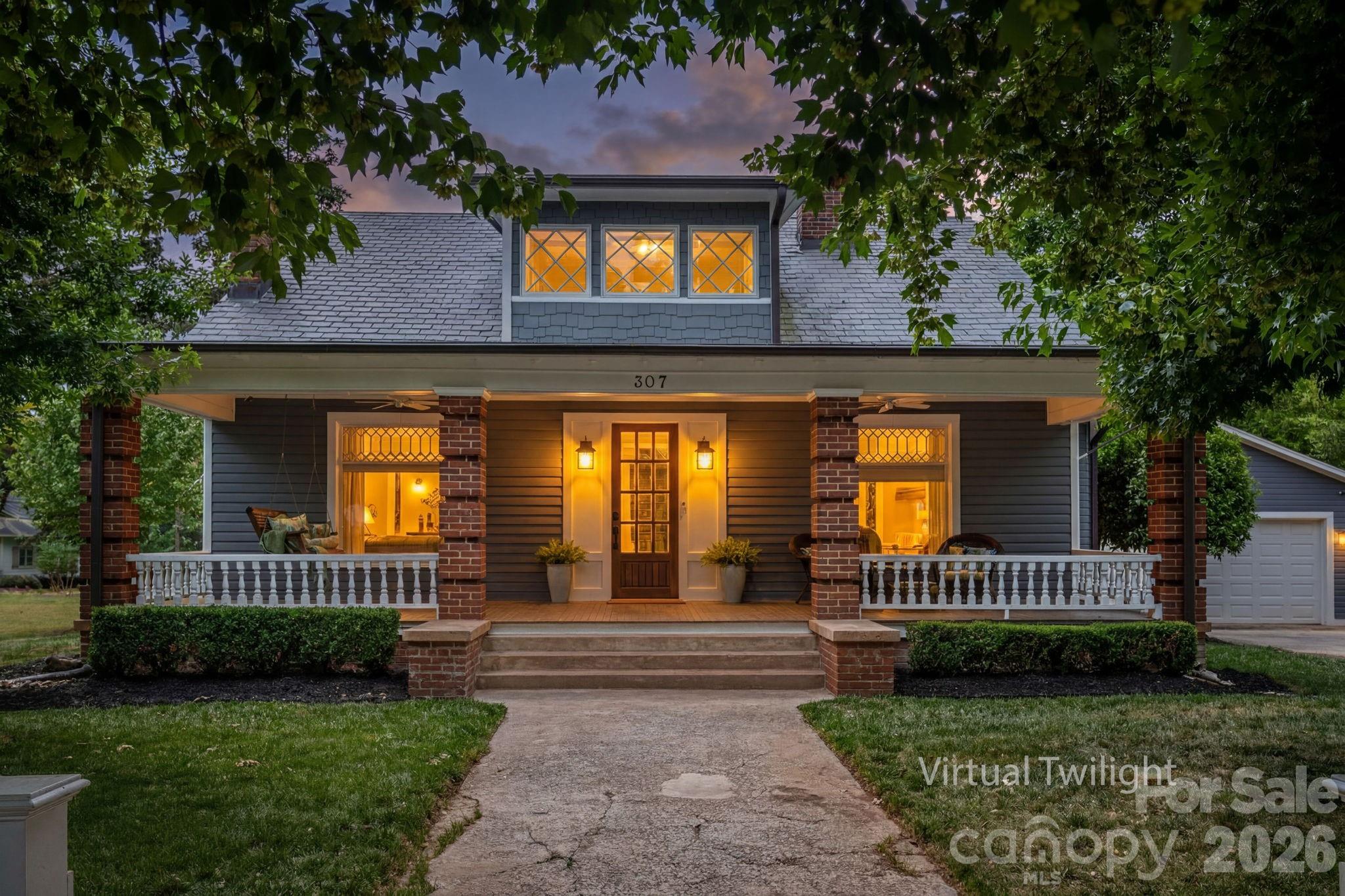 Luxury, history, and a premier LOCATION... Welcome to one of Belmont's most coveted addresses! 307 N. Main St. is a masterclass in designer finishes and historic soul, located just a two-minute stroll from the heart of Downtown Belmont! Immerse yourself in timeless CHARACTER from the moment you walk in, with the best of the past - from original doors, hardwood floors, and elaborate moldings and fireplaces- combined seamlessly with modern luxury finishes. The showstopping chef's kitchen is the true heartbeat of the home, offering ample space for all to gather! With high-end appliances, two full sinks, and a center island that is simply unrivaled in scale, the butler's pantry featuring a full-size wine fridge is the Pièce de Résistance! The primary suite offers a true retreat with duo, custom walk-in closets, a luxurious bath with a tiled shower and an original, refinished claw foot tub! Upstairs, discover three spacious bedrooms, a quiet literary office overlooking Main St. with built-in desks and bookshelves, and 2 full bathrooms. Embrace the outdoors on the full-length front and back porches, or escape to your own backyard oasis- complete with a paver stone patio, an inviting pergola and a pristine saltwater pool. Located just steps from Downtown Belmont's best dining, shopping, public library, local parks, art exhibits, and historic sites... it's time to call 307 N. Main St. "HOME"!