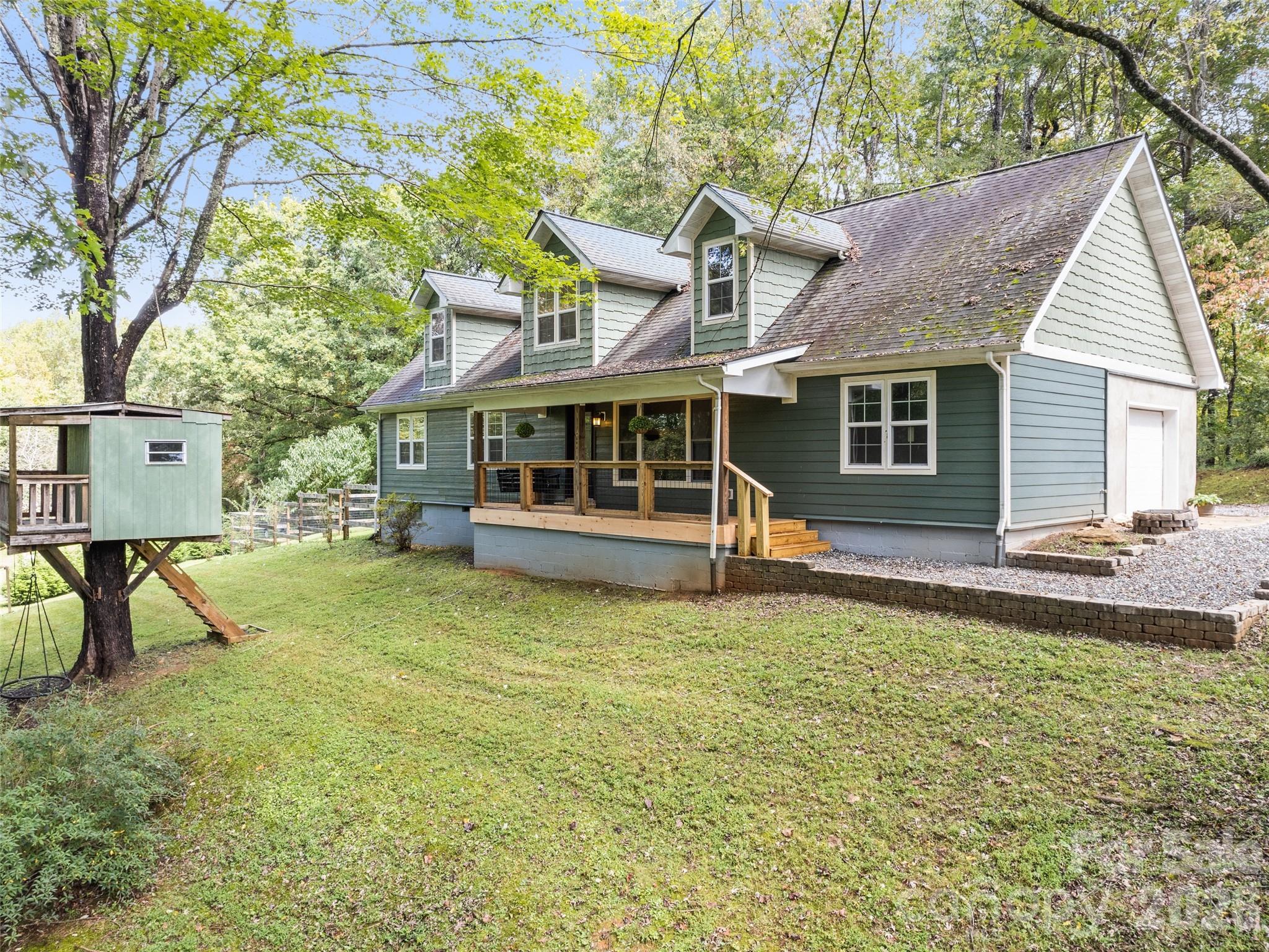 Price below appraised value & move in ready—an exceptional opportunity in the heart of Sylva. This spacious home offers the ease of primary-level living, with the main suite and office on the main floor. Additional bedrooms plus a bonus room upstairs, perfect for guests or hobbies. Hardwood floors, built-ins, and generously sized rooms create a warm, welcoming feel throughout. The primary suite invites you to unwind with a spa-inspired bath featuring an oversized custom tile shower with nine shower heads and a relaxing jacuzzi tub. Outside, enjoy the updated porches while overlooking the level, fenced yard and whimsical treehouse—ideal for pets, play, or gardening. Additional features include an attached garage with storage, extra parking, tankless water heater, and convenient access to Main Street Sylva, WCU, shopping, dining, and the highway.