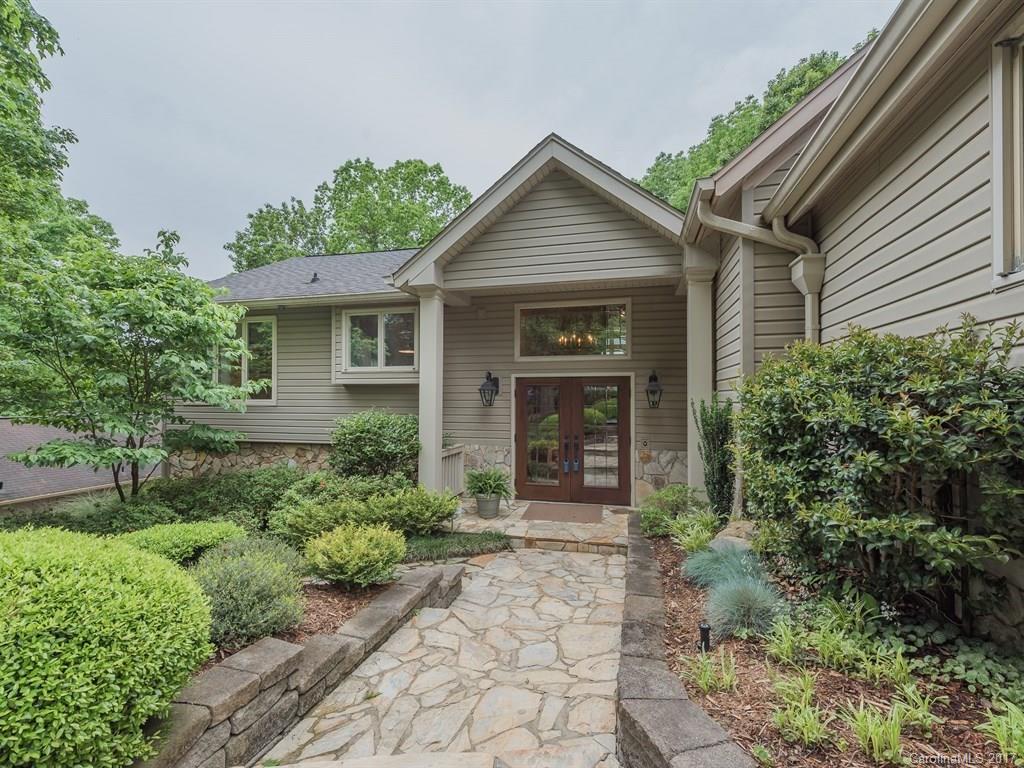 Lovingly cared for waterfront home in park-like setting! Many, many improvements; you can anticipate the quality as you walk up to the house. Huge great room with vaulted ceilings, master suite, & a possible second living quarters on lower level. High end built-ins, 2013/17 HVAC, low maintenance decks. View of lake from nearly all rooms! Potential for 4 BRs if downstairs office is converted. Fantastic landscaping, lot terraced w/stone walls. Beautiful!