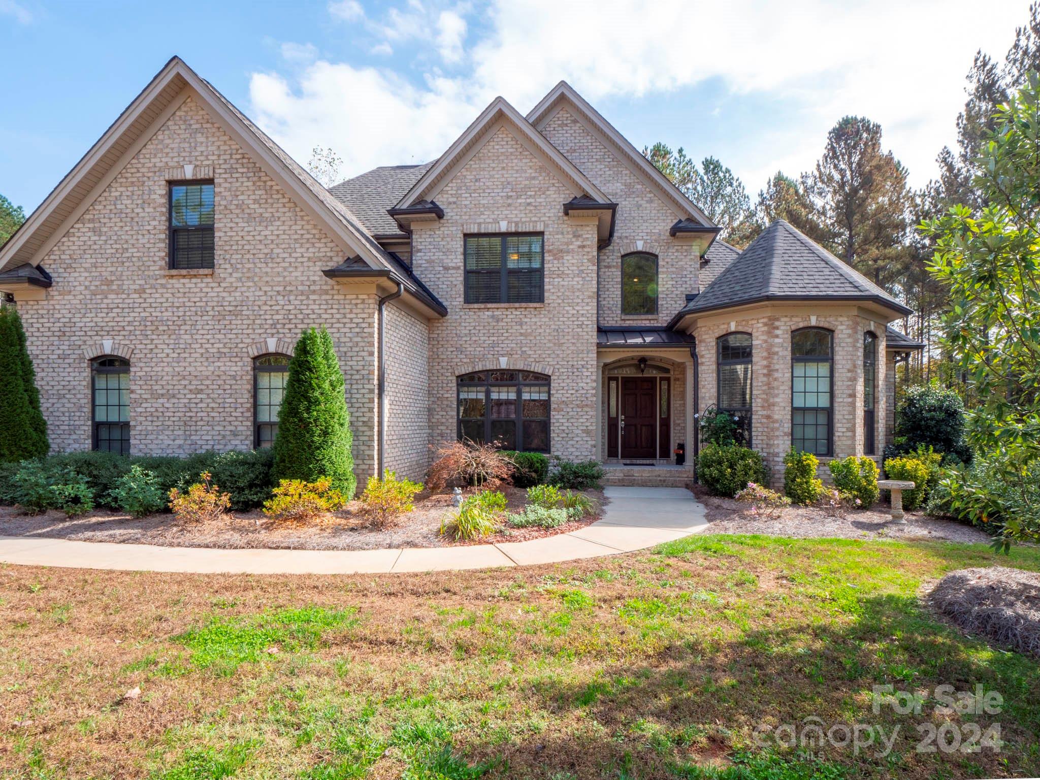 Custom home on  1 Acre in picturesque country setting.  Wonderful 4bed/3bath custom home.  As you enter, you'll be greeted by a two story entryway, open concept family room with views to the tree-lined backyard.  The spacious kitchen looks out over the family room and features an island, eat in dining.  Plenty of cabinet and counter top space for your most avid chef. Easy access from kitchen to  separate dining room/office.  A primary bedroom suite on main with room for seating, large primary bath with soaker tub! A  split floor plan, on the opposite side of the home is a hallway that leads to dedicated laundry room, full bath and a guest bedroom. First floor guest room offers private and main level access.  Ascending the beautiful open staircase to find  two bedrooms,  dedicated bonus room and full bath. On demand water heater.  Home features a 2 car garage and is conveniently located to shopping (5 miles) while providing a country setting.