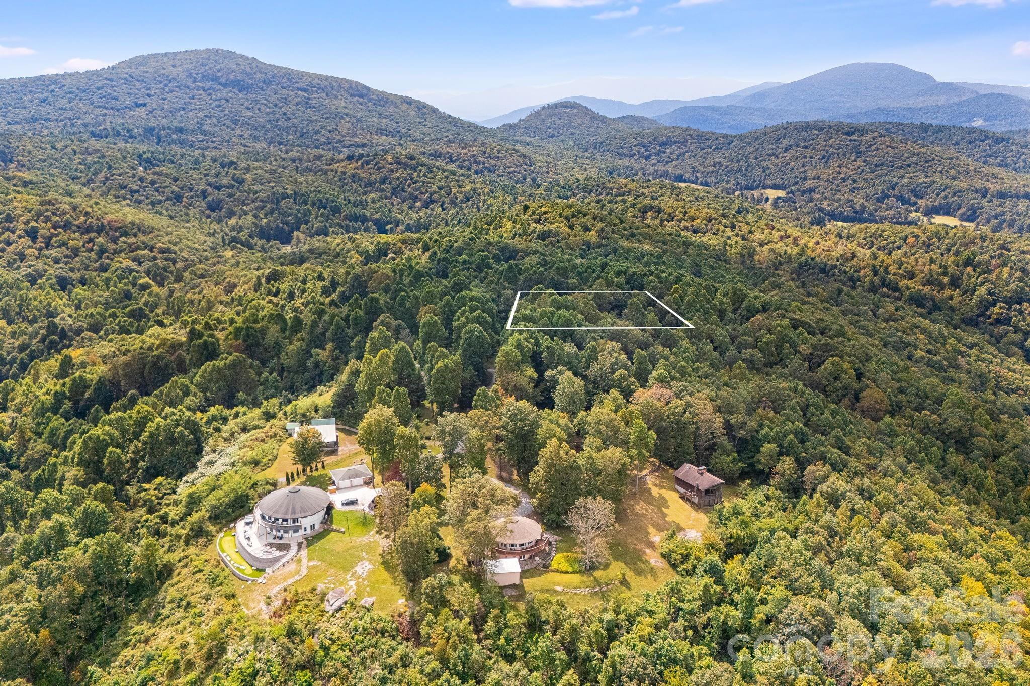 SELLER FINANCING AVAILABLE | Owner Will Carry – Negotiable Terms! Build Your Mountain Dream Home in Gated Deer Run Estates. Skip the strict bank lending requirements and buy this beautiful .86-acre parcel directly from the seller. Located in the highly sought-after, peaceful community of Deer Run Estates, this property offers privacy, mature trees, and potential panoramic Blue Ridge views. It is the perfect canvas for your custom mountain getaway or investment property, located just minutes from charming downtown Black Mountain and scenic Chimney Rock State Park.