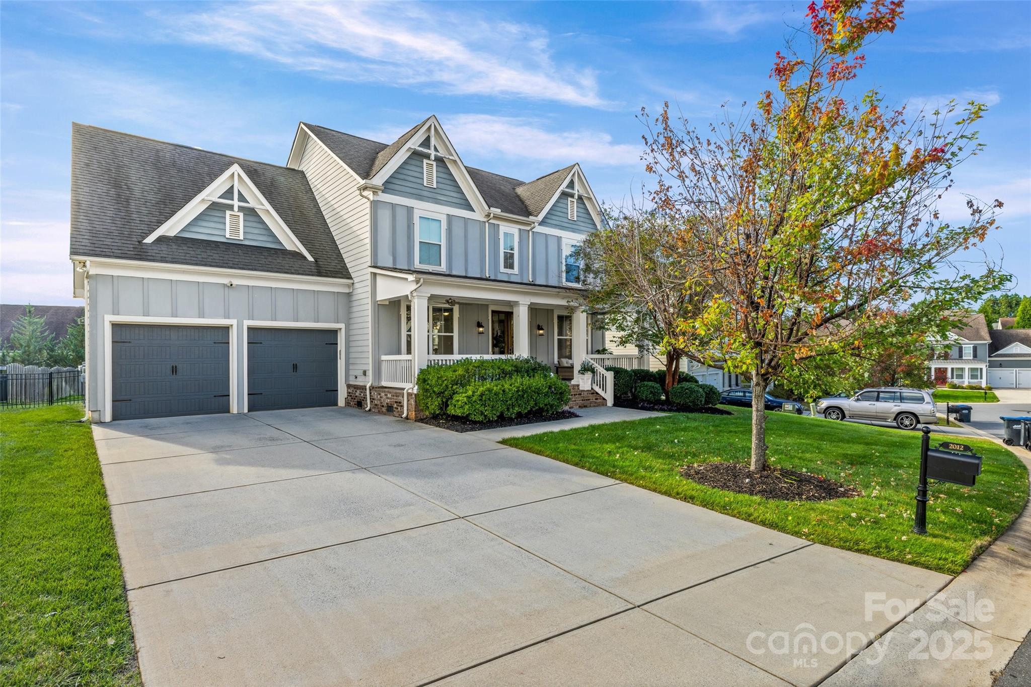 Perfect for the Fall season, this stunning John Wieland–built home welcomes you with a sprawling front porch and elegant double-stained entry doors — an ideal spot to unwind. Inside, you’ll find a light-filled, freshly painted interior featuring neutral 5-inch plank hardwood floors and an inviting open layout. The main level includes a convenient guest suite with a full bath, perfect for visiting guests or a private home office. The kitchen truly serves as the heart of the home, showcasing white cabinetry, gorgeous granite countertops, a stylish backsplash, under-cabinet lighting, a gas cooktop, and a charming white farmhouse sink. A large wood stained island with seating and additional cabinet storage opens effortlessly to the living and dining areas — ideal for everyday living and easy entertaining. Upstairs, brand-new carpeting leads to a relaxing primary suite complete with a walk-in closet, new quartz countertops, and a separate tiled shower and tub. Two additional bedrooms share a Jack-and-Jill bath, while a large bonus room at the end of the hall provides flexibility for a playroom, media space, or home gym. Step outside to a deck and fenced backyard offering endless possibilities to create your perfect space. Located in the highly desirable Bridgemill community, residents enjoy resort-style amenities including a clubhouse, two pools, pickleball courts, pocket parks, and a serene pond. Just a short walk to the front of the neighborhood brings you the convenience of to two local restaurants, and a bakery — the perfect blend of comfort, convenience, and community. This exceptional home combines timeless craftsmanship with modern updates — a true gem in one of the Indian Lands most sought after neighborhoods.