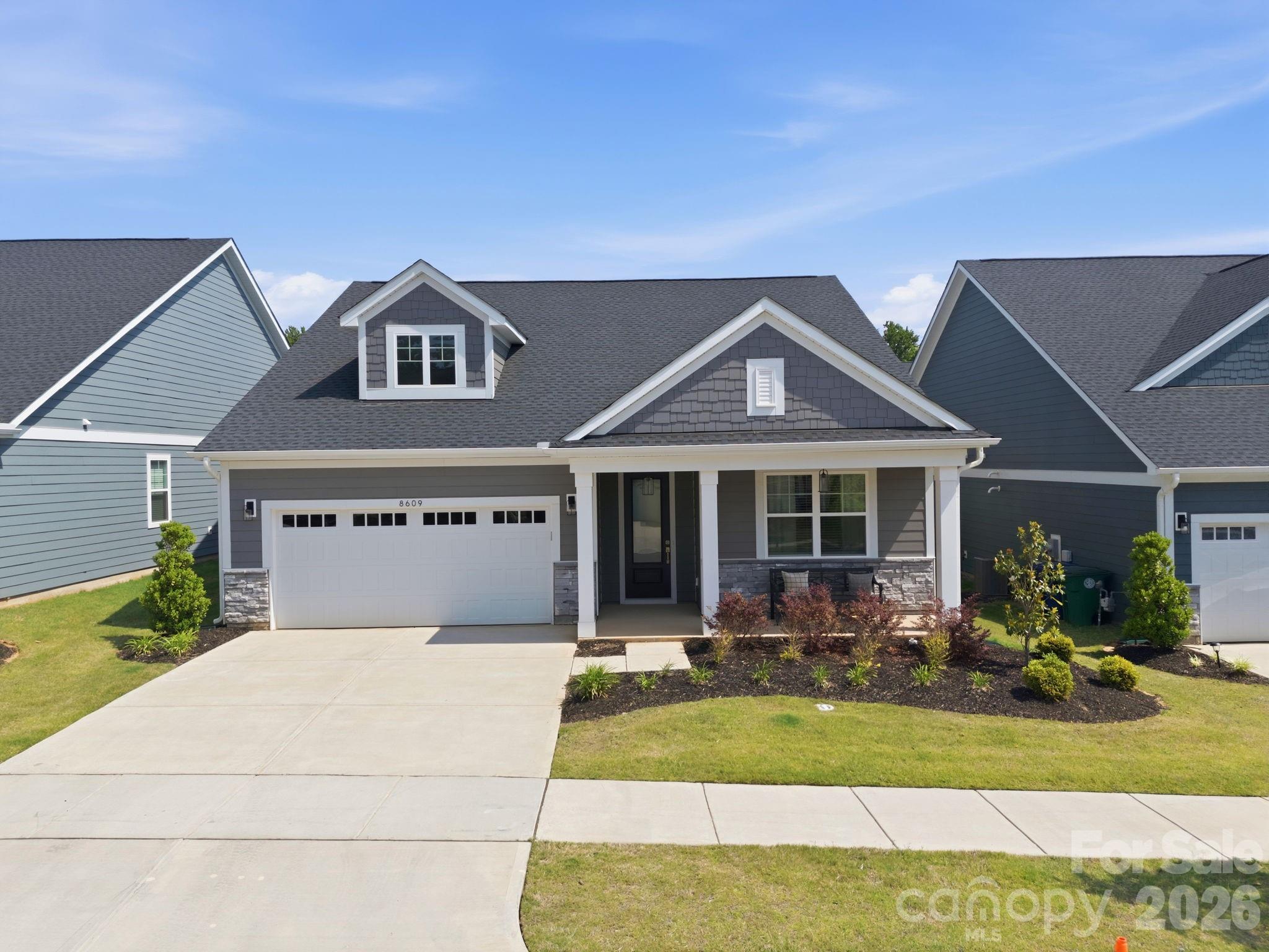 Welcome to easy living in this established 55+ community, now offering homeownership opportunities in one of Cornelius’ newest active adult neighborhoods. Discover the stunning Oasis floorplan, a newly built luxury ranch home featuring 3 bedrooms, 2.5 baths, and a 2-car attached garage. Thoughtfully designed with comfort and accessibility in mind, this home offers wider hallways and upscale finishes throughout, including 9’ ceilings, plywood cabinetry with soft-close drawers and doors, HardiePlank siding with stone accents, a tankless water heater, tile shower, and much more.The gourmet kitchen features custom cabinetry, abundant workspace, and a spacious pantry, all flowing seamlessly into the open and functional living areas. Beautifully designed inside and out, this home combines modern elegance with low-maintenance convenience.This community is part of the Alexander Farms Master Plan, which upon completion will feature retail, shopping, and a senior center with planned amenities shared by the neighborhood. Ideally located in one the best Charlotte metro areas, residents will enjoy future direct access to Birkdale Village and surrounding areas via the planned Northcross Extension and multipurpose path. Conveniently located near Westmoreland Athletic Complex, the new Atrium Health Lake Norman campus, shopping, dining, Lake Norman access, and I-77 — all within approximately five minutes. Welcome Home.
