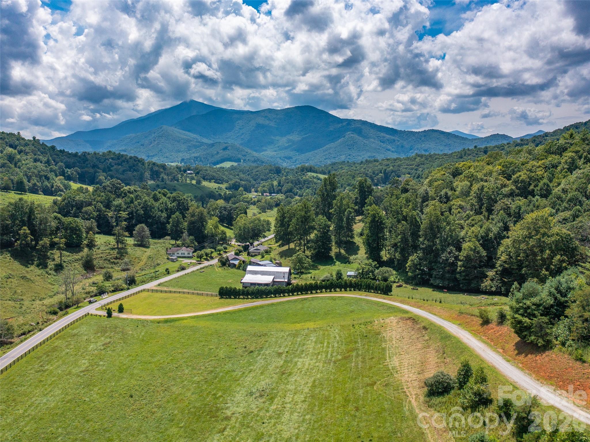 Lot 5 and 6 shares a driveway already on the lots' border allowing easy access into the property. Locust Rough Mtn Development is a new development with gated entrance and large lots and low density of homes with only 9 total lots in Phase I for sale. Located just four minutes from the quaint town of Burnsville in Yancey County (known for 3 rivers, 10 of the highest peaks East of the Rockies, plenty of hiking and mountain bike trails, sporting spectacular vistas. The area is known to draw a ton of artists.