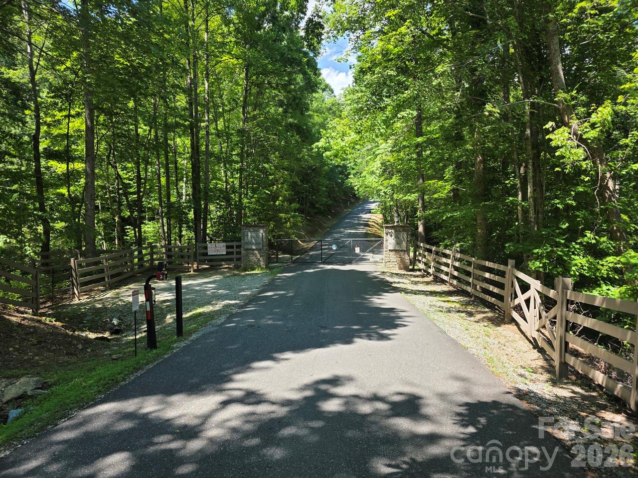 Discover this peaceful, nearly 3.5 acre lot with both sloping and nearly level build sites in the gated Grants Mountain community, offering the perfect blend of convenience, seclusion and mountain views. Located just minutes from town yet tucked far enough into the mountains to enjoy true peace, privacy, and tranquility, this property provides an ideal setting for a future home or retreat. The lot offers easy access and extends all the way to a quiet cul-de-sac, ensuring no through traffic and privacy. Mature mountain surroundings create a beautiful canvas for building in one of Marion’s most sought after communities. A rare opportunity to secure acreage in a serene, well maintained mountain neighborhood close to shopping, dining, and everyday essentials. Visit grantsmountain.com to review the covenants, architectural guidelines and learn interesting facts about this special community!