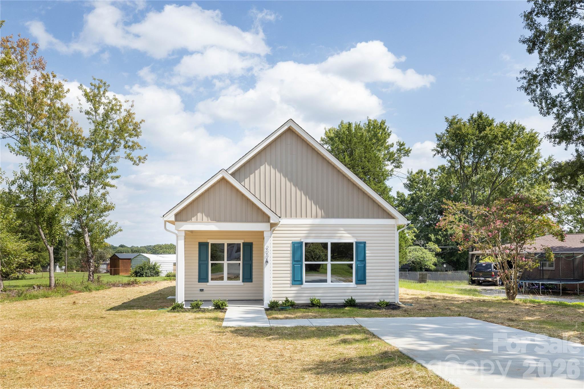 This thoughtfully designed new construction ranch is nestled in an established west Charlotte neighborhood with convenient access to the airport, major interstates, and everyday amenities. Offering 3 bedrooms and 2 bathrooms, the efficient open-concept layout seamlessly connects the kitchen, dining, and living areas—perfect for both everyday living and entertaining. The kitchen features modern finishes, ample cabinetry, and a functional design, while the primary suite includes a walk-in closet and private bath for a comfortable retreat. A covered front porch adds charm and outdoor enjoyment, and the home’s smart layout maximizes space throughout. Schedule your tour today and experience the benefits of new construction in a well-established, growing area.