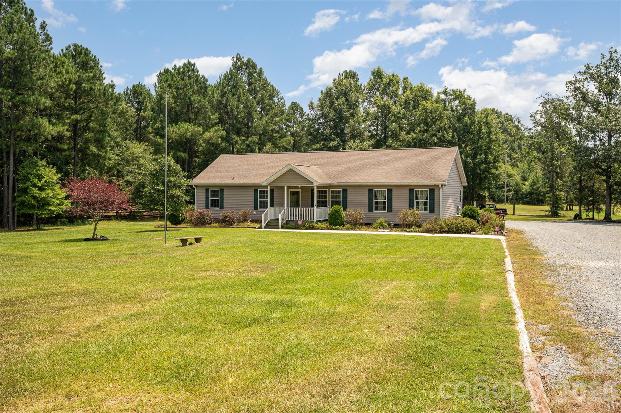 Welcome to your peaceful slice of heaven! This charming home offers the perfect blend of quiet country living with easy
access to town, shopping, dining, and the 74-bypass—close enough for convenience, yet far enough to enjoy tranquility.
Freshly painted inside, you’ll love relaxing on the lovely deck or front porch, soaking in the serene views. The split bedroom
floorplan provides privacy and comfort, while outbuildings and fencing add great functionality. Plus, there’s an option to
purchase the adjacent 1-acre lot for even more space. Don’t miss out on this wonderful opportunity to live your best life!