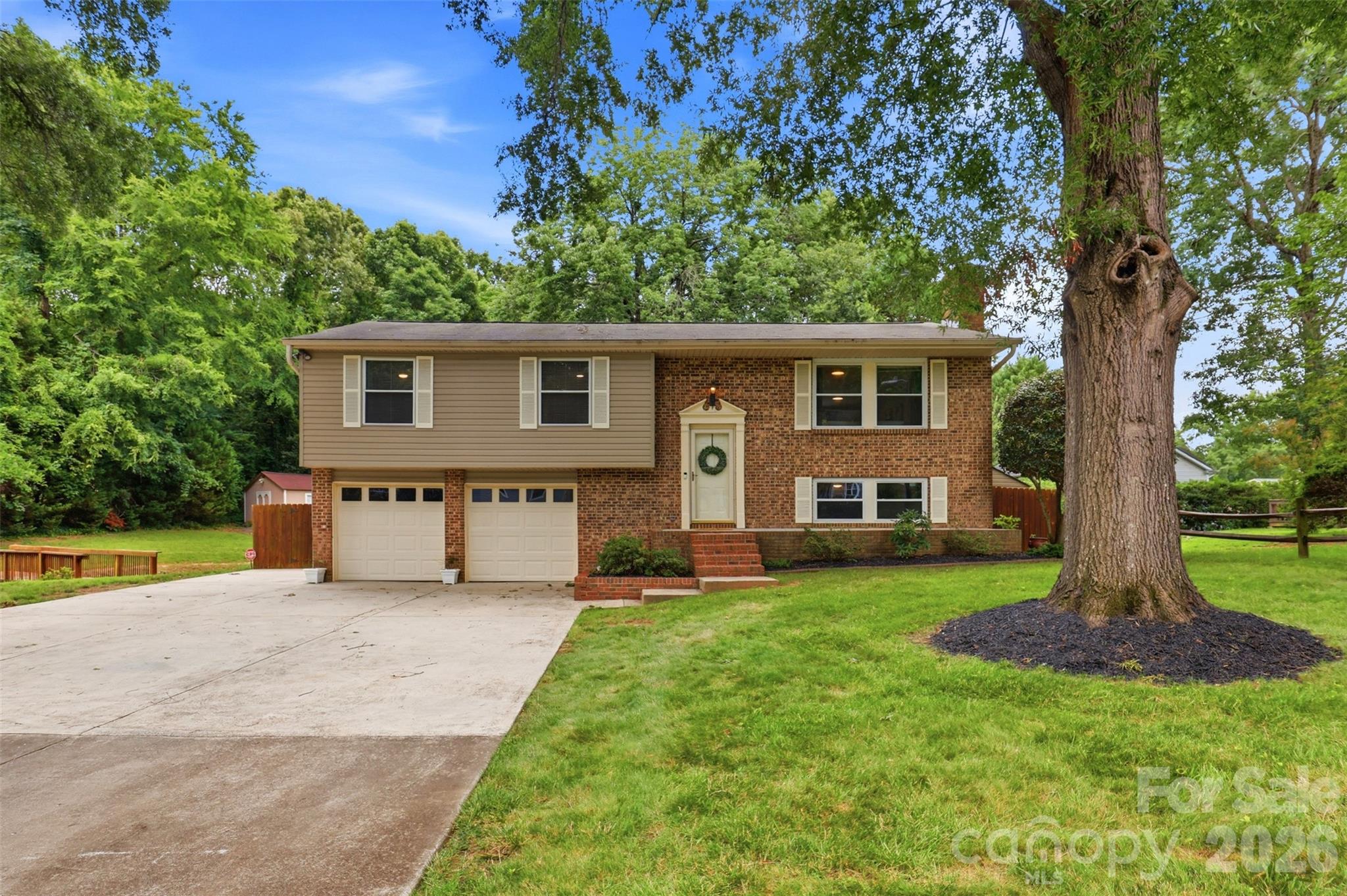 Tucked into the sought-after Waverly Hall section of Stonehaven and surrounded by mature trees, this move-in ready 3-bedroom, 2.5-bath home sits on over half an acre in the heart of South Charlotte—just minutes from Cotswold, SouthPark, and Uptown. Inside, the fully remodeled kitchen steals the show with a big, beautiful island, all-new cabinetry, fresh countertops, and brand-new appliances, opening into a large, light-filled living space designed for easy everyday living and effortless entertaining. Durable LVP flooring runs throughout the entire home—no carpet anywhere—lending a clean, cohesive feel from room to room. Just off the kitchen, a brand-new Trex deck invites you outdoors to a backyard that feels like a private, quiet oasis, complete with towering trees, a tranquil creek, and a charming bridge—plus an above-ground pool and hot tub for year-round relaxation and entertaining. Downstairs offers incredible flexibility with room for one or two offices, a second living area, a home gym—whatever your lifestyle calls for. Add a one-car garage and an unbeatable South Charlotte location, and you have remarkable space and value at $600K!