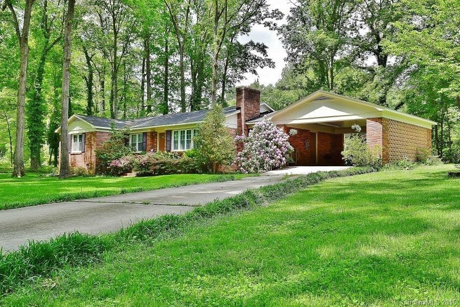 Come home for good in this all-brick beauty that marries turn-key modern features with charm and character. Nestled on the greenest corner lot in all of Forest Hills, you will have plenty of room to relax and play in the summer sun streaming through the mature trees. Inside, you will find beautifully updated kitchen & bathrooms, plenty of entertaining space w/formal dining, living & den. All appliances convey with property! The pictures won't do it justice, come see your new home today!