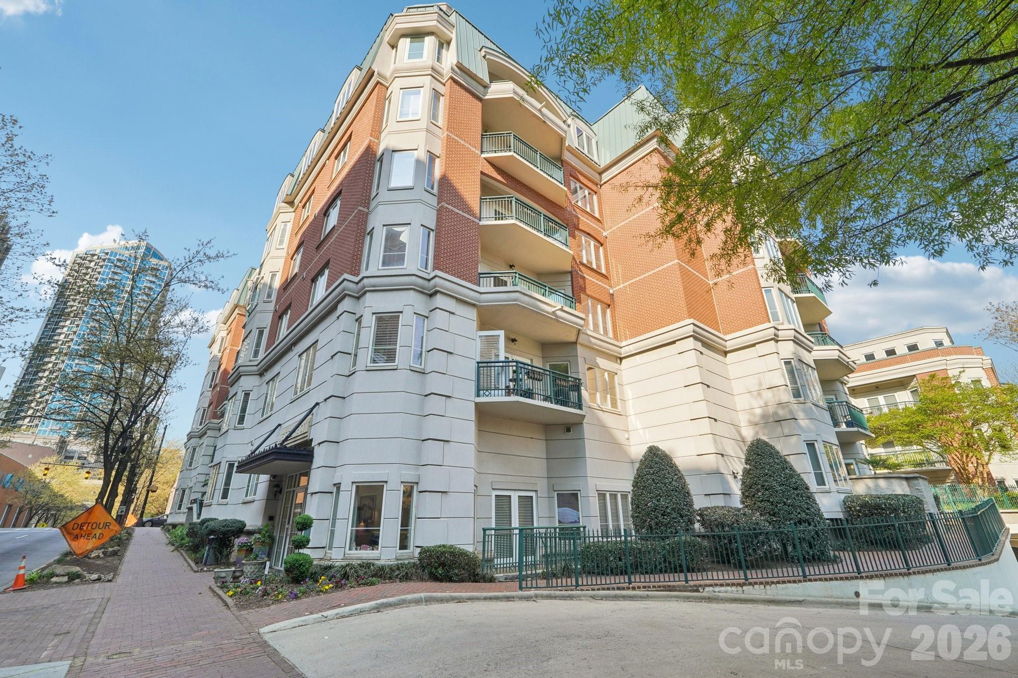 You really can have it all! This Condo in highly sought after Historic 4th Ward offers all of the access and excitement of city living with these rare conveniences - 2 deeded secure parking spaces in the attached deck, private storage room and gas available for a balcony grill. The open split bedroom floorplan offers abundant natural light that shines on the gleaming hardwood floors.  It can be used as 3 bedrooms or 2 ensuite masters and a den opening through glass French doors  The rooms are all spacious and the custom walk-in closets are a dream.  A full laundry room offers abundant extra storage. The  many upgrades include renovated kitchen with light cabinets, new quartz countertops and recent stainless steel appliances. These tastefully curated features make it feel like a brand new condo. Recent HVAC and Hot Water Heater replacement offers extra peace of mind.  Amenities include an onsite fitness center and a private courtyard sanctuary.  Unbeatable walkability provides the lifestyle you have been seeking.   The 4th Ward park is one block away as are everything from morning Starbucks to evening wine bars. Walk to everything and enjoy!