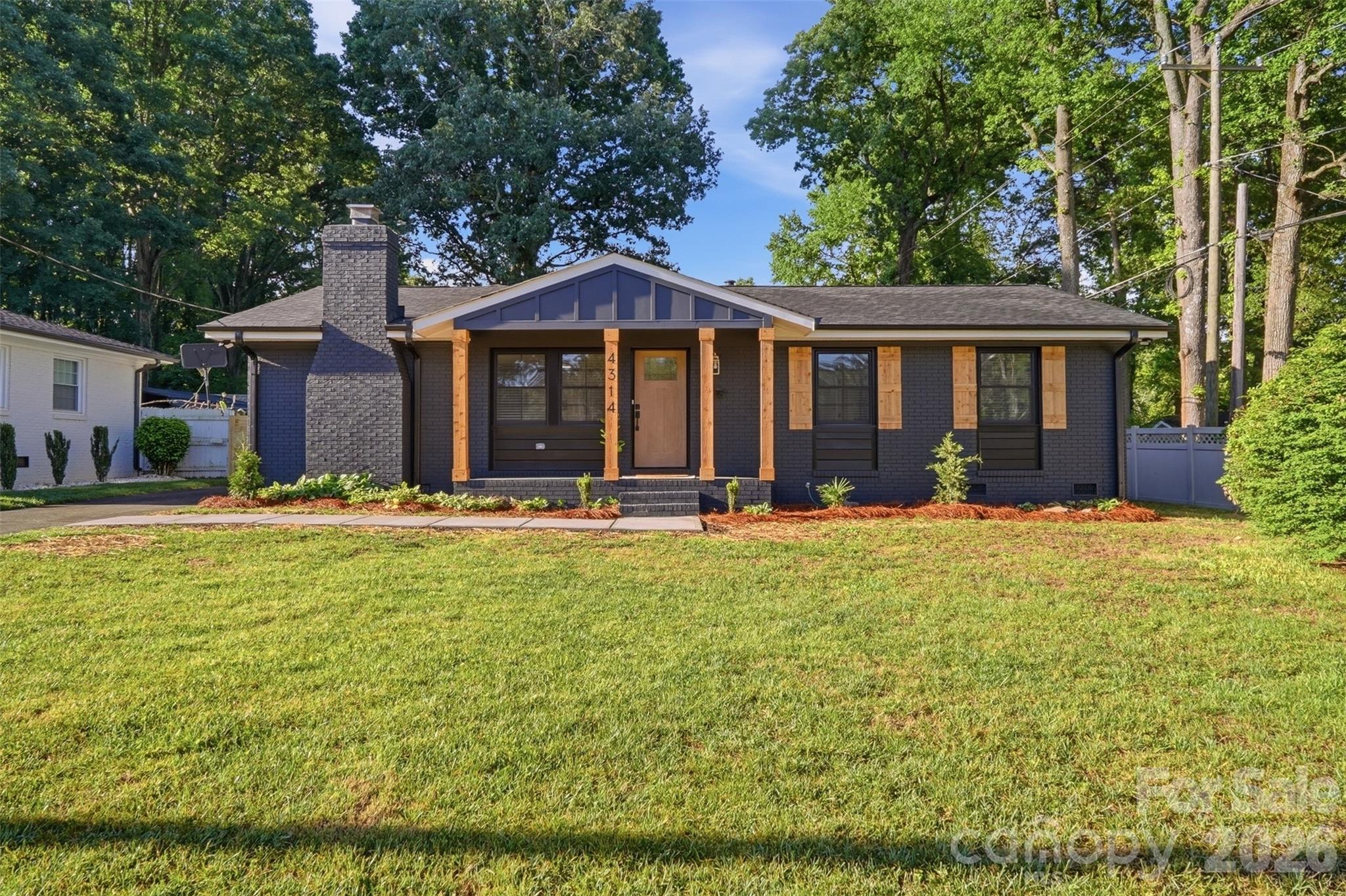 Welcome to this stunningly renovated modern ranch in the heart of Charlotte’s highly sought-after Windsor Park neighborhood! This beautifully redesigned one-story home offers 3 bedrooms and 2.5 baths with a bright, open-concept layout and high-end contemporary finishes throughout. Every detail has been thoughtfully curated, featuring sleek designer lighting, wide-plank hardwood flooring, a show-stopping modern kitchen with stylish cabinetry, quartz countertops, an apron sink and updated fixtures that create a truly elevated living experience.

The spacious primary suite offers a luxurious retreat complete with accent ceiling beams and skylights! The primary suite also offers a spa-inspired ensuite bath, while the additional bedrooms provide flexibility for guests, family, or a home office. Entertain effortlessly indoors and out with inviting living spaces filled with natural light and a seamless flow perfect for modern living. A 400 square foot storage shed is wired for electricity and can readily become a gym, workshop, man cave or she shed!! Located just minutes from Plaza Midwood, NoDa, and Uptown Charlotte, this move-in ready gem combines sophisticated style with one of Charlotte’s most charming and established neighborhoods. Schedule your private showing today!!