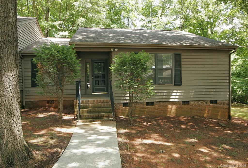 Peaceful serene setting. Backs to woods and set back from street. Open floor plan nicely upgraded throughout. Bright clean white kitchen has 2 years old smooth top range; sink. Great living room has stone wood burning fireplace. Spacious bedroom with nice closet space. Enjoy your deck that back to woods. Don't miss the storage closet. Even lighting upgrade.