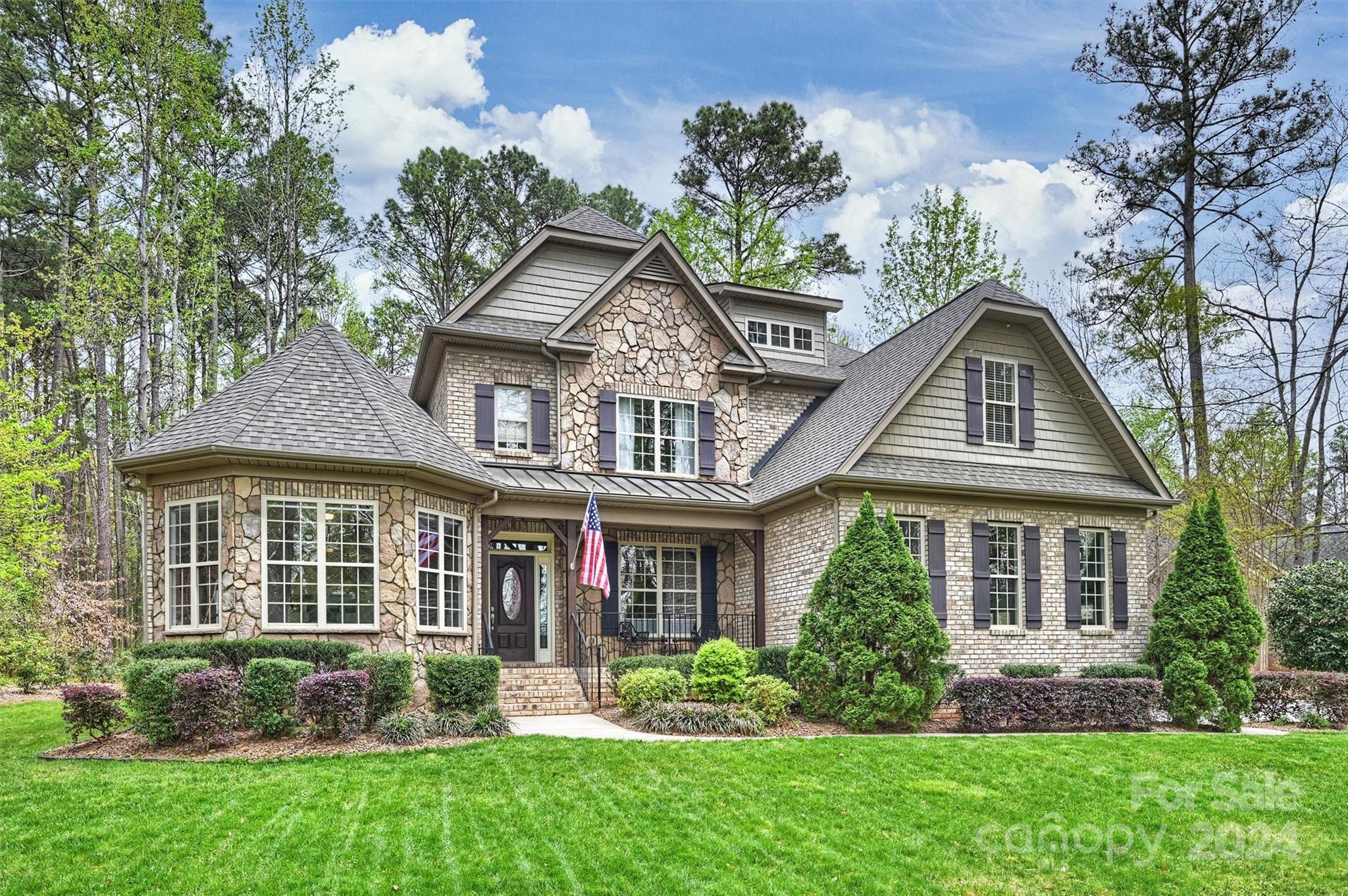 Pristine and spacious all brick, 5 Bed, 3.5 Bath home in coveted Heron Cove. Hardwoods throughout; open floor plan is perfect for entertaining. Lg Great Room for gatherings & formal areas for more intimate settings. Chefs will love the roomy Kitchen w/gas cooktop & plentiful granite counters. Primary on main is like a tranquil retreat backing up to private, treed backyard. Natural light-filled Study w/built ins facing Lake Wylie w/seasonal views. Upstairs find four additional bedrooms, two full baths, an oversized Media Room, and a Bonus Room; perfect for use as a storage area, playroom, or flex space. Lovely screened porch w/wood burning fireplace sets the stage for your private backyard paradise complete with terrace & fire pit. New Roof 2023, Encapsulated crawl 2022, New Tankless Water Heater 2020, New hardwood floors 2019.* Heron Cove amenities include pool, playground, walking trails, lake pavilion & kayak launch. 2.4 miles to Buster Boyd Bridge, lake access, restaurants & shops.