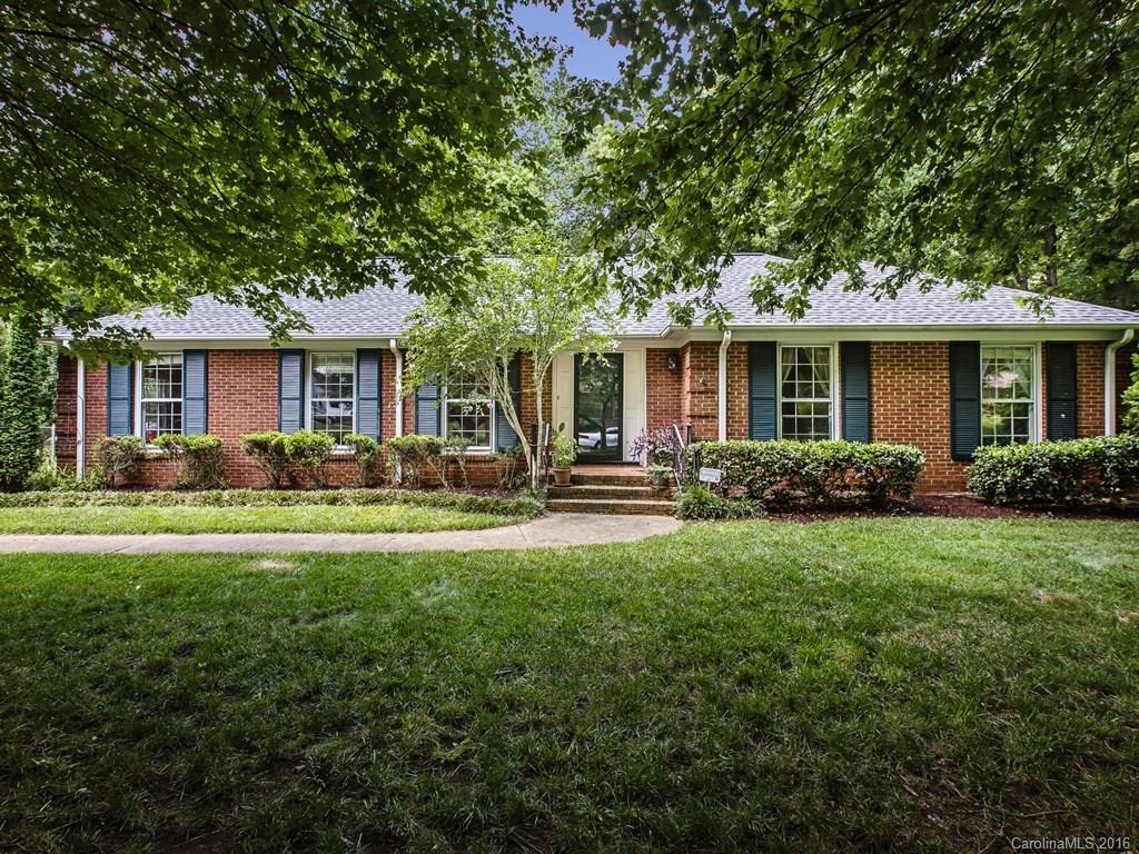 Spacious brick ranch in up & coming "MoRA" area is a must see! New HVAC just installed, roof in 2011, new laminate flooring, updated mstr bath, kitchen has stainless appliances, washer/dryer/refrigerator to remain. Has large eat in kitchen, separate dining rm, living rm & inviting den w/fireplace.  Enjoy the large, private fenced back yard for entertaining.  Conveniently located within minutes to uptown, schools, restaurants, as well as all renovations in the area. 1 year home warranty included.