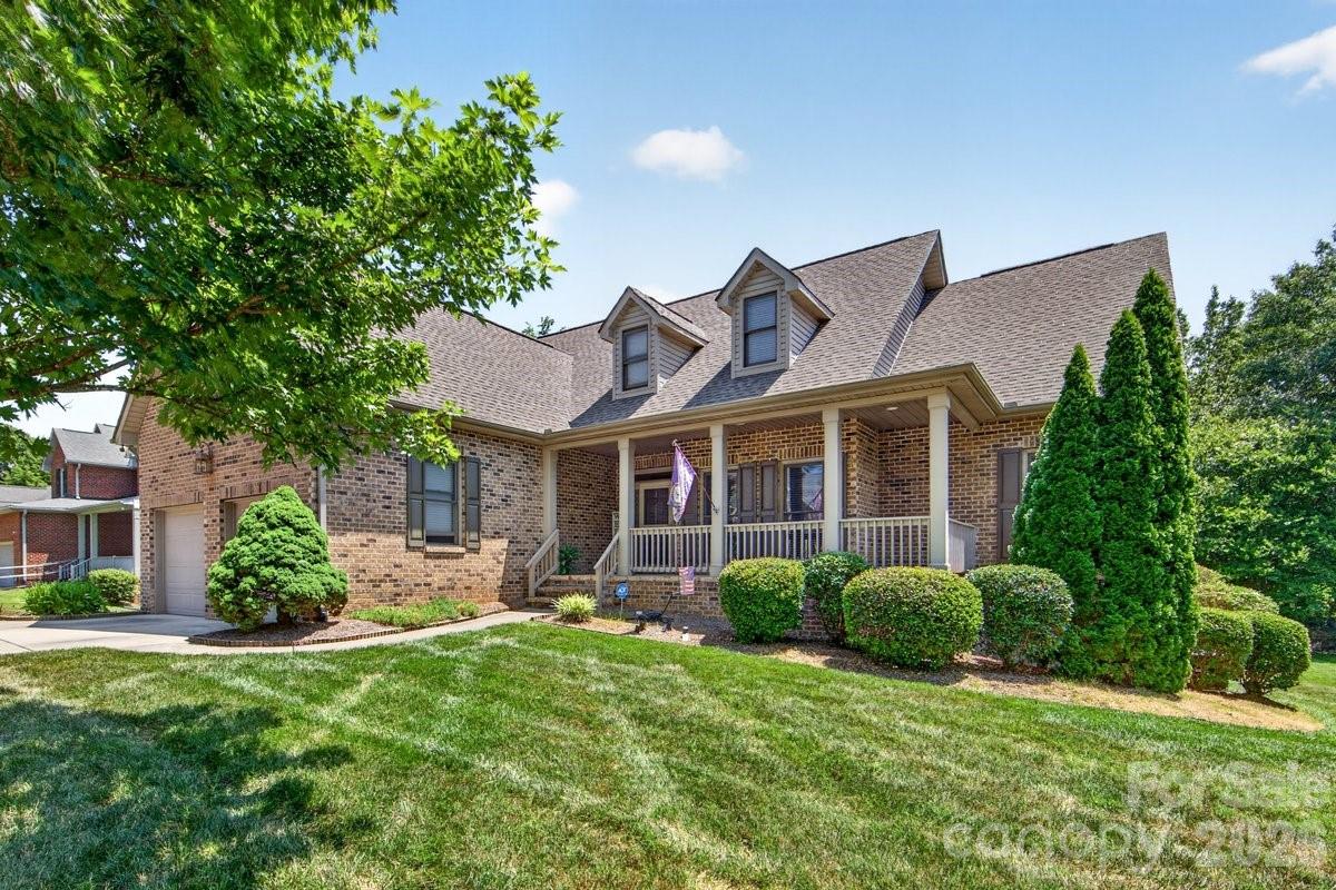 This all-brick ranch is well maintained inside and out, offering a covered front porch & open floor plan inside w/ wood floors in the  foyer, family room, dining room, & kitchen. Home has a primary bedroom & 2 bedrooms on the main level, as well as large 4th bedroom/bonus room upstairs with extra space for storage or possible expansion for more HLA. Primary ste. has a sitting area that could be used for nursery, workout space, office, etc.), & walk-in closet. Updated primary bathroom has designer tile shower, & double bowl sinks. Open family room has high vaulted ceiling, & gas log fireplace. KItchen has recently replaced stainless steel appliances, painted white cabinets, pantry, breakfast area & overhang countertop for barstools. Seller replaced the HVAC in 2025. Enjoy the semi-private backyard from either the screened in or open deck area. There is tons of potential in the 2000 sqft. of unfinished basement which is framed, clean, dry, and features a fireplace(.  Step out of the basement to a serene shaded(from deck above) area for additional outdoor entertaining. 
This custom home is perfectly positioned between Uptown, Charlotte-Douglas Airport, the White Water Center, Lake Norman, and major highways.  Just down the street is one of the newest access points to the Charlotte Greenway system. Home is also approx. 12 miles from downtown Charlotte.
