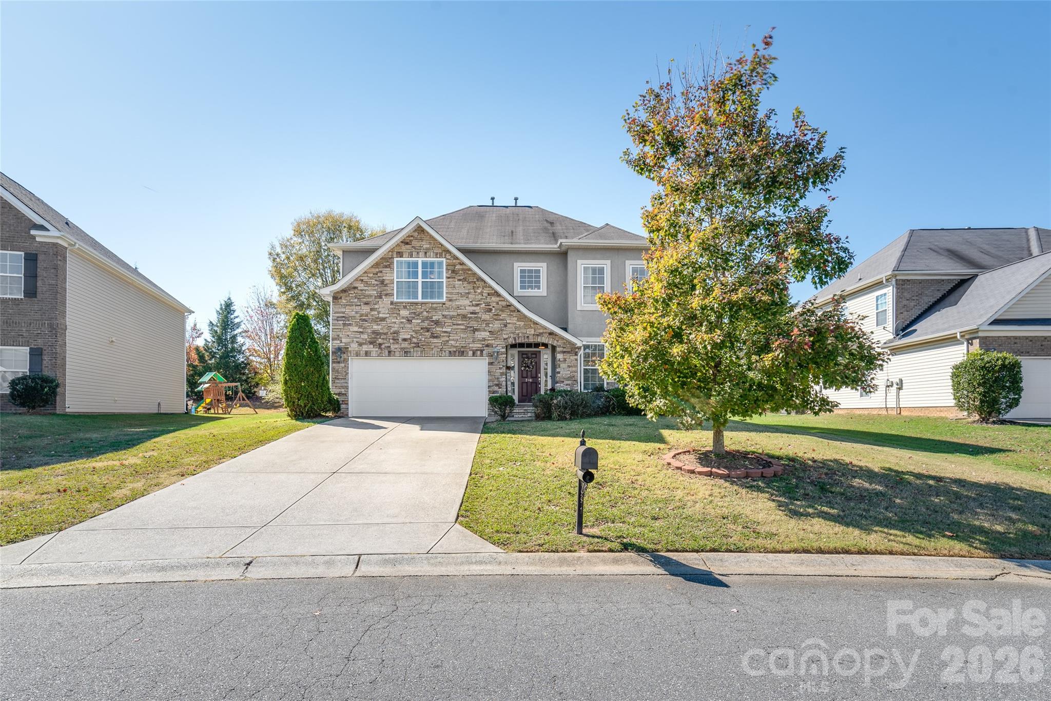 Perfect layout - 4 bedrooms 2.5 bathroom meticulously maintained home. New roof in 2025, New Central Heat and Air 2025 and range in 2025. Beautifully appointed home in Chastain Village subdivision! Cook's kitchen opens to the breakfast nook, dining room and den. Kitchen island is the right size for serving all of your delicious meals. Double trey ceiling in the primary bedroom and dining room add to the style. Cozy den with stone faced fireplace anchoring the room makes it cozy in all four seasons. Sun room off the breakfast area toward the back of the home is ideal for morning coffee and conversations or evening wine too. Convenient office space off the entry foyer could be enclosed for added privacy. Second floor primary bedroom suite is one of the largest in this price range!! Engineered wood flooring through out make this home easy to clean and maintain. Stone exterior on the front of the home adds a luxury feel and elegance to the first impression. Three guest bedrooms on second floor and convenient laundry room as well. Community pool is ideal for summer time - buy now and enjoy the season! Convenient location to Indian Land for shopping and services! Book your appointment today - you'll be glad you did!