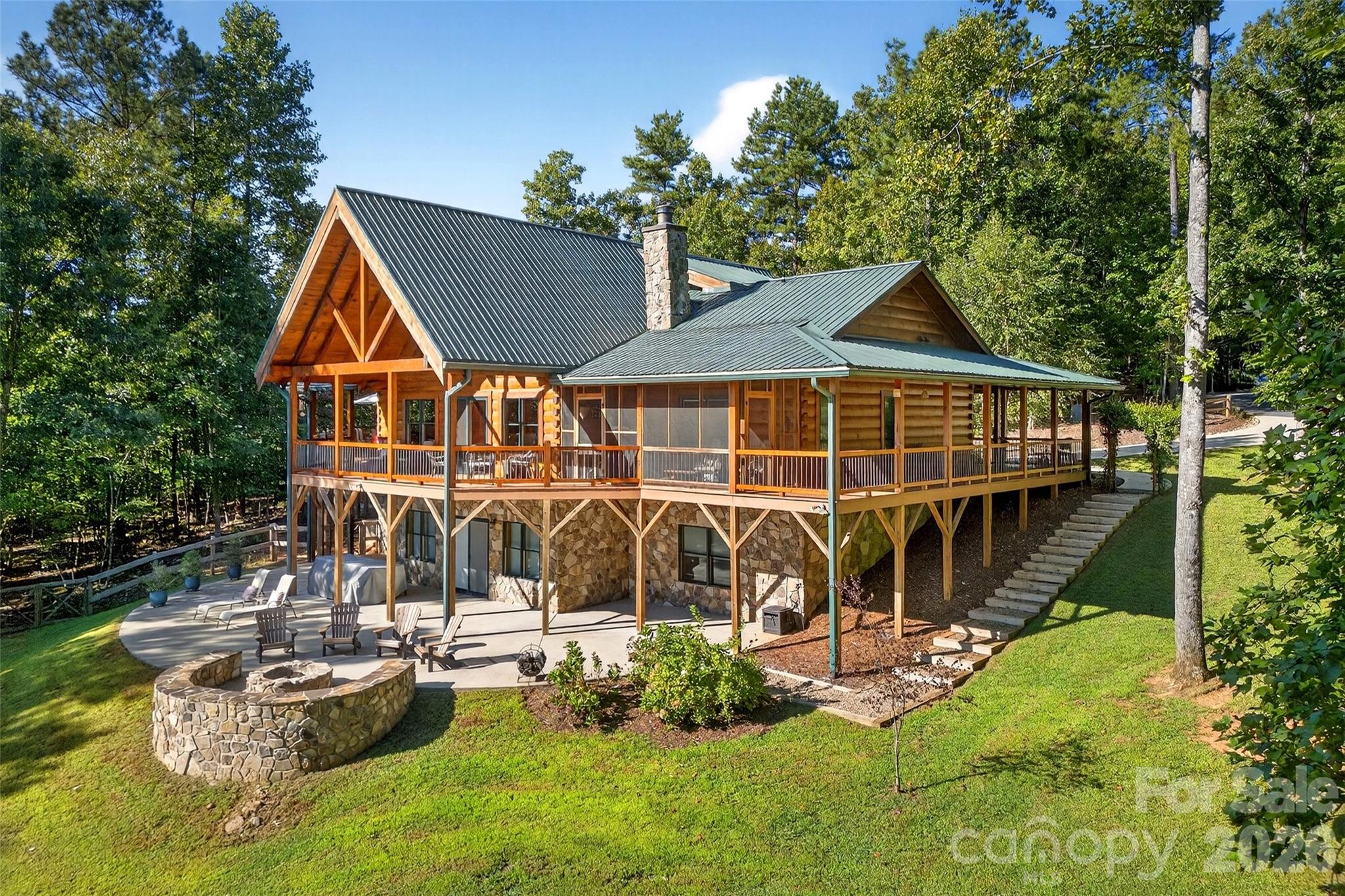 A must SEE......Welcome to your own private mountain retreat, where over ten sprawling acres of natural beauty meet thoughtful craftsmanship and modern convenience. This stunning 4,042 square foot home offers three bedrooms and three and a half bathrooms, all nestled beside a serene community lake with dock access just mere steps from your wrap-around porch.

The quality of construction here is immediately evident. If the front door alone doesn't convince you of the workmanship crafted through the home then there are other features that would support that fact. From the front entry your eye is drawn immediately to the South Mountains. Then the gorgeous custom kitchen and open dining space blends warm rustic charm with modern functionality creating an inviting and highly livable space. Natural wood walls and hardwood flooring throughout ties the entire room together with a cohesive earthy feel. The custom painted cabinetry offers a sophisticated contrast to the wood tones, extending to the ceiling for ample storage and a clean, built-in look. 

A wood-burning fireplace anchors the living room, while propane powers the stove, oven, and water heater. A full-house generator with shed load ensures you never skip a beat during storms, and a whole-home water filtration system delivers pure refreshment from every tap.

The oversized 36-by-28 garage is a dream, featuring a generous storage loft with walk-up stairs measuring 16 by 36 feet — because you can never have too much storage!  An already-sectioned parking spot accommodates your recreational vehicle, making weekend adventures effortlessly convenient.

Step outside and discover several walking paths the seller has created throughout the ten-acre parcel, perfect for exploring by utility vehicle or on foot. The fire pit overlooks a lovely backyard where privacy and peacefulness reign supreme. With only three lots on this quiet road — all included in this property — your nearest neighbors are the birds.

Downstairs, a roughed-in wet bar awaits your finishing touches in the basement, promising endless entertaining potential. You've heard of Custom homes before, but this property is Custom PLUS! More upgrades than space to mention them all.

This is more than a home — it is a lifestyle. Schedule your private tour today and experience mountain living at its finest.