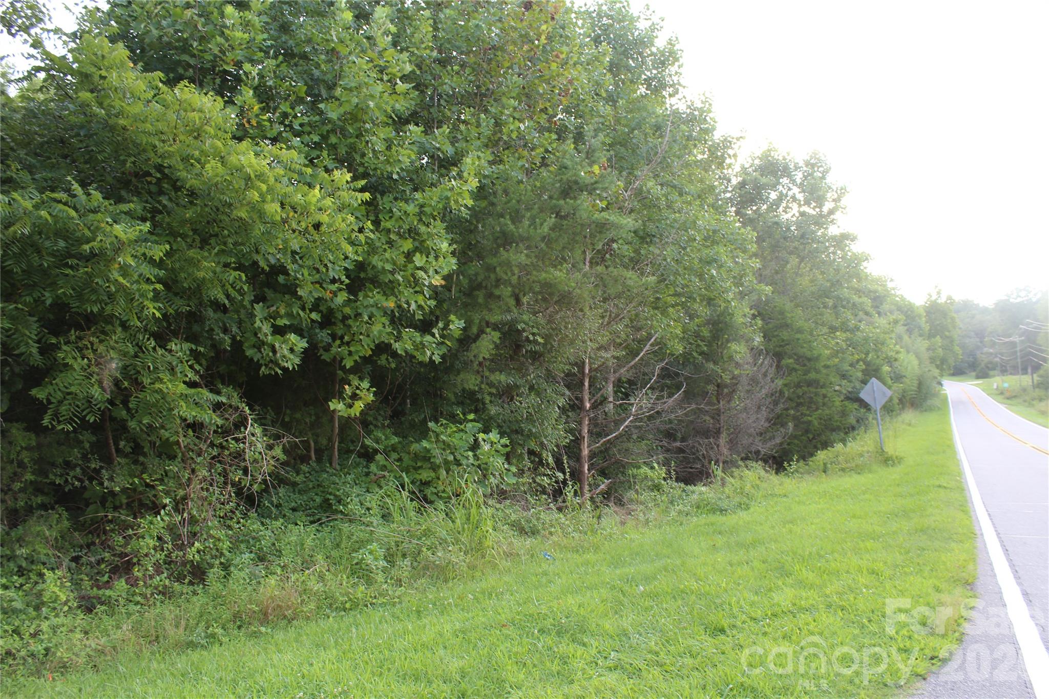 This property, located outside the city limits offers an incredible opportunity to build your dream home and enjoy the serene and tranquil atmosphere that surrounds you. With ample space and a beautiful landscape, this property presents a canvas for your imagination to run wild. Don't miss out on your opportunity to own this beautiful lot, schedule your showing today!!