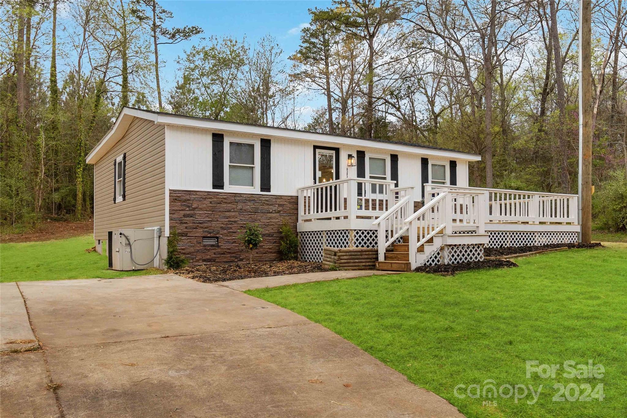 Cute updated 3 bedroom home in Clover School District.  You'll enjoy the newly installed front porch that wraps the front and side of the home and provides 2 entryways.  Upgraded features have those farmhouse touches with pendant lighting, shiplap in the entry and bathroom, built-in bookcase, and hardwood floors in the kitchen & living areas.  The kitchen includes an eat-in bar, butcher block countertops, ceiling high cabinets, featured herringbone backsplash and all electric appliances.  The primary room sits to the rear of the home and features an ample closet with a barn door.  The full bathroom has neutral tile features and flows into the laundry room providing plenty of storage space.  In the backyard you'll enjoy the concrete patio that provides a lounging space with room for firepit. 
This property is 2 miles from Oakridge Elementary and Middle School, 1.5 miles from the NC state line, and 5.5 miles from Buster Boyd boat ramp in Lake Wylie.  You won't want to miss this one!