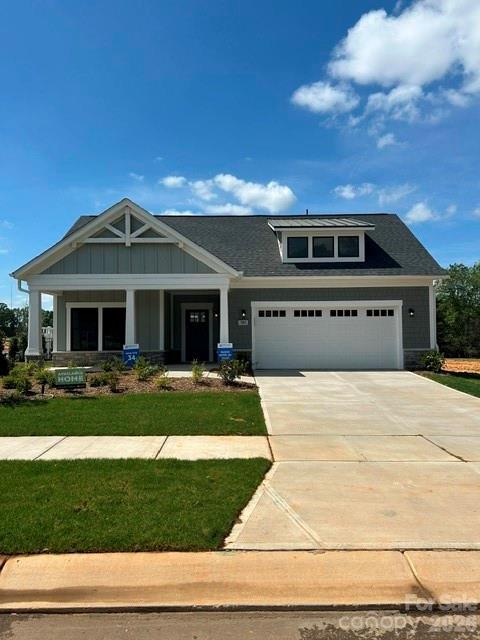 Inventory home - This luxury ranch home features the expertly curated Portico floor plan. Spacious owner's suite, large closet, bright second bedroom, den with glass doors and a gorgeous private courtyard. Our homes are designed to make your life easier and more enjoyable. The Courtyards at Hodges Farm has quick roadway access to nearby I-485 and I-85. Located near UNC Charlotte and University Research Park. The majority of the homes back up to a mature tree line or green open space. This quick move in home will be available in February 2026
