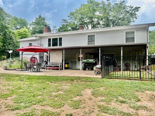 Lovely 3 BR, 2.5 bath home with lots of updates & situated on 3.65 acres! Updates include a new metal roof in 2022, new HVAC system in 2025, new flooring in kitchen, laundry rm, & 1/2 bath in 2022, new Anderson windows in basement and also sitting area on main level in 2024, new dishwasher 2024, new double metal carport in 2023.  As you enter the home, you'll find a sitting area with fireplace, the primary bedroom with ensuite bath & lots of closets, and the other two bedrooms with another full bath off the hall. The open staircase leads to the daylight basement with a large family room that has another fireplace, a large kitchen, the laundry room, and a half bath.  Lots of wood in this home with wood ceilings throughout. There is also a carport attached to the home but it has been closed-in for storage.  At the back of that carport is a small workshop area. There are three storage buildings. A concrete drive leads to a large patio out back that is partially covered - great for enjoying the private backyard or entertaining!  The backyard also has a firepit and a fenced area for your pets.  There's a space for an RV and there are hookups but sellers have never used them and do not guarantee that they still work. Home is very clean & move-in ready!  Convenient to Hwy 74 and approx. 1 hour to Charlotte, Spartanburg/Greenville, or Asheville. Don't miss this one!